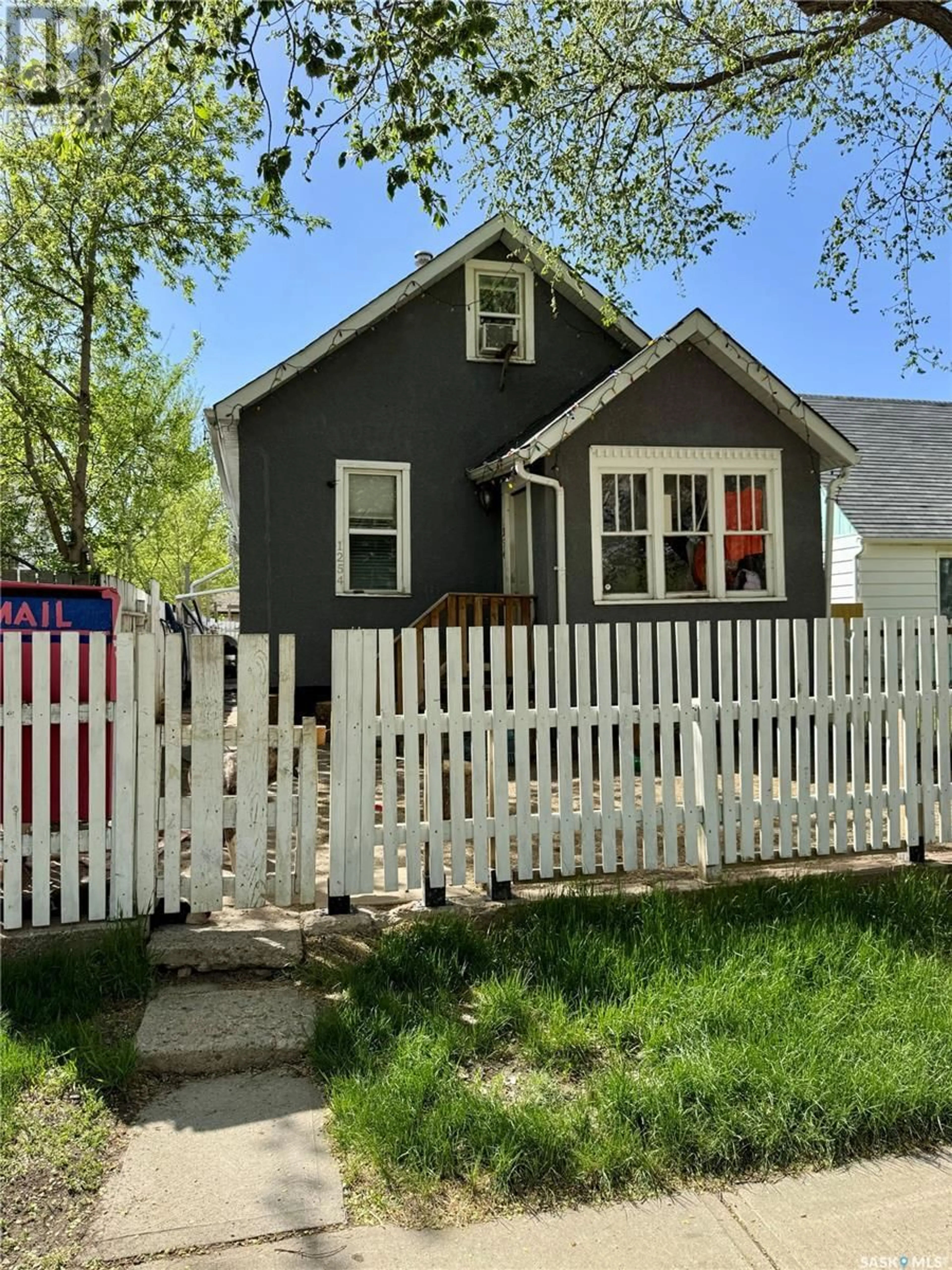 Home with vinyl exterior material, street for 1254 WASCANA STREET, Regina Saskatchewan S4T4J1