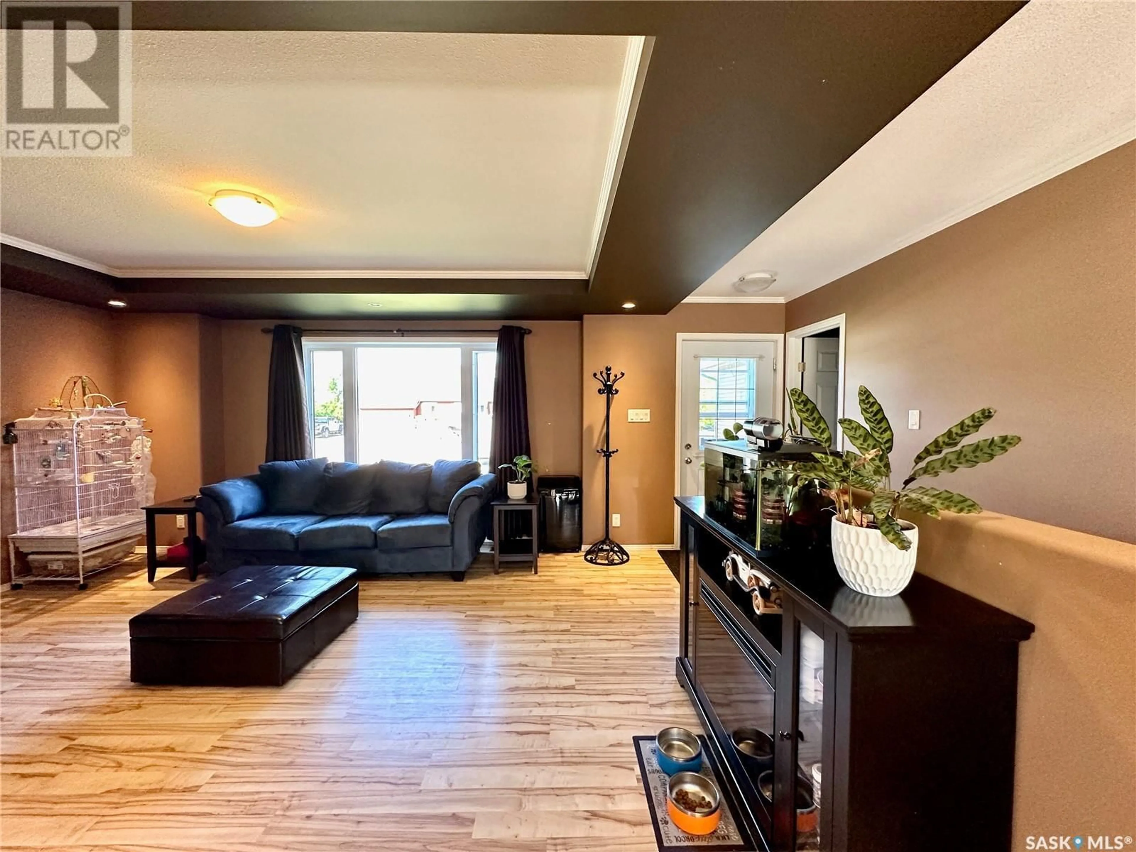 Living room with furniture, wood/laminate floor for 308 MAPLE DRIVE, Allan Saskatchewan S0K0C0