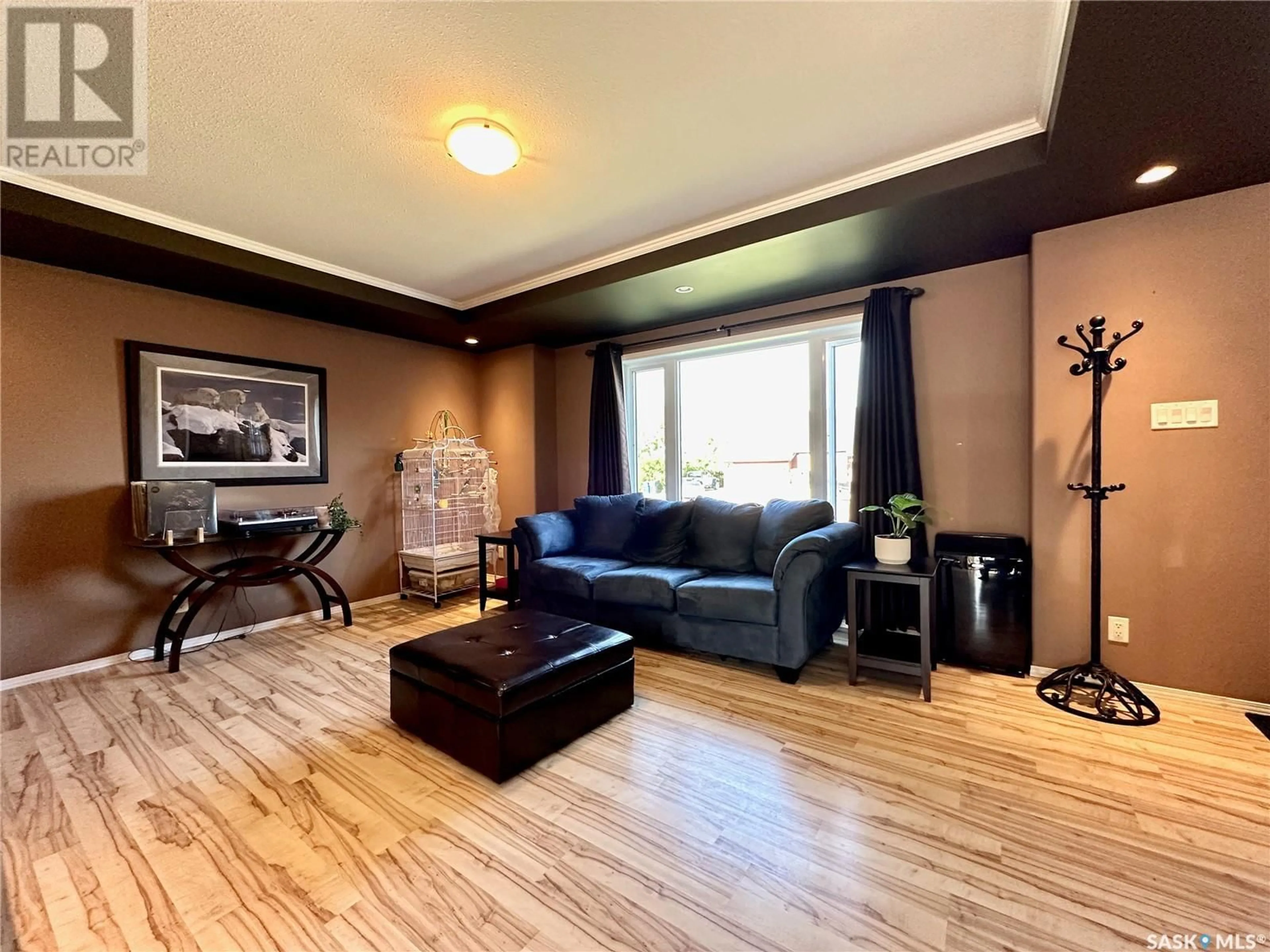 Living room with furniture, wood/laminate floor for 308 MAPLE DRIVE, Allan Saskatchewan S0K0C0