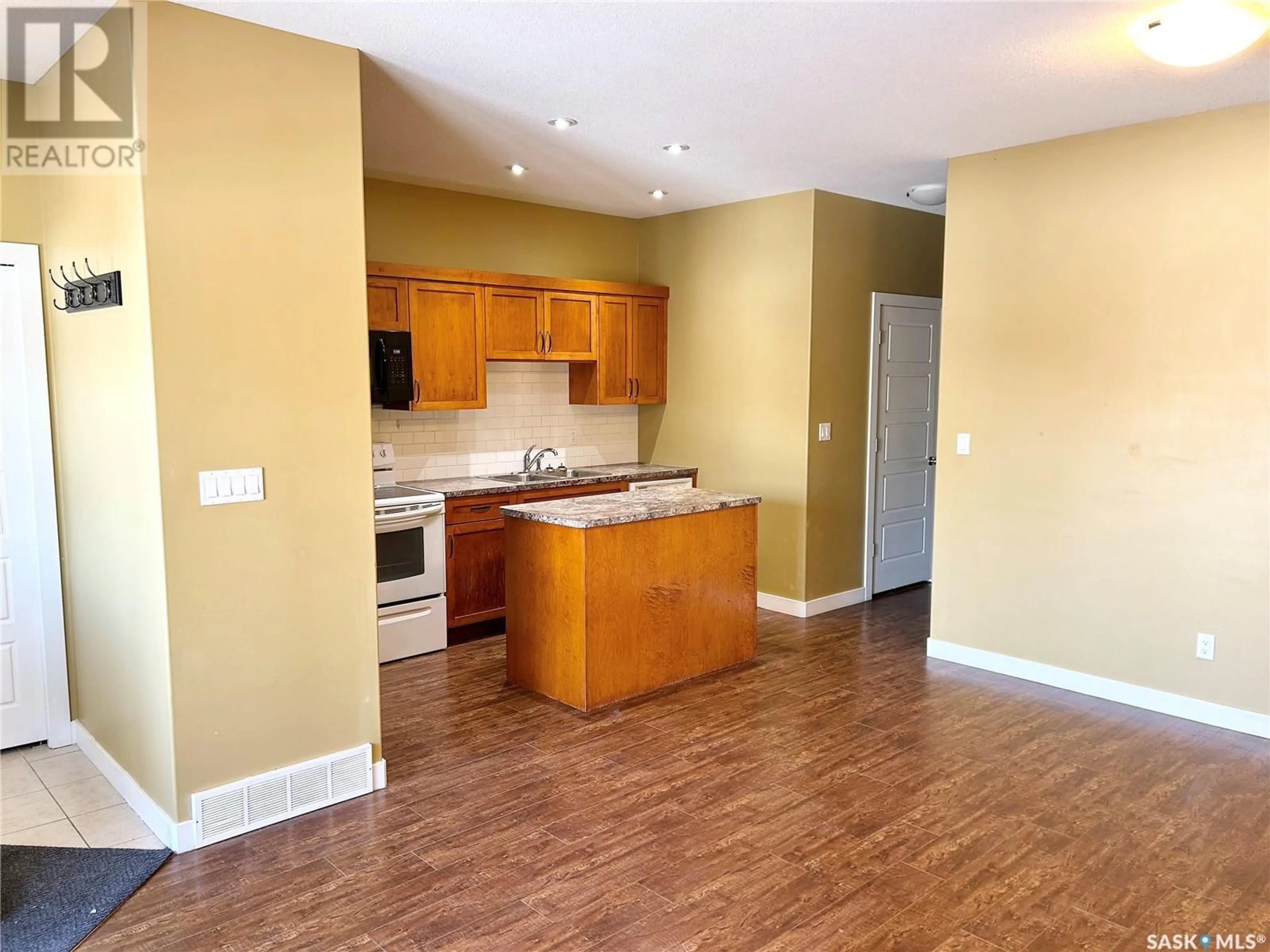 Open concept kitchen, wood/laminate floor for 1069 LINDSAY STREET, Regina Saskatchewan S4N3A8