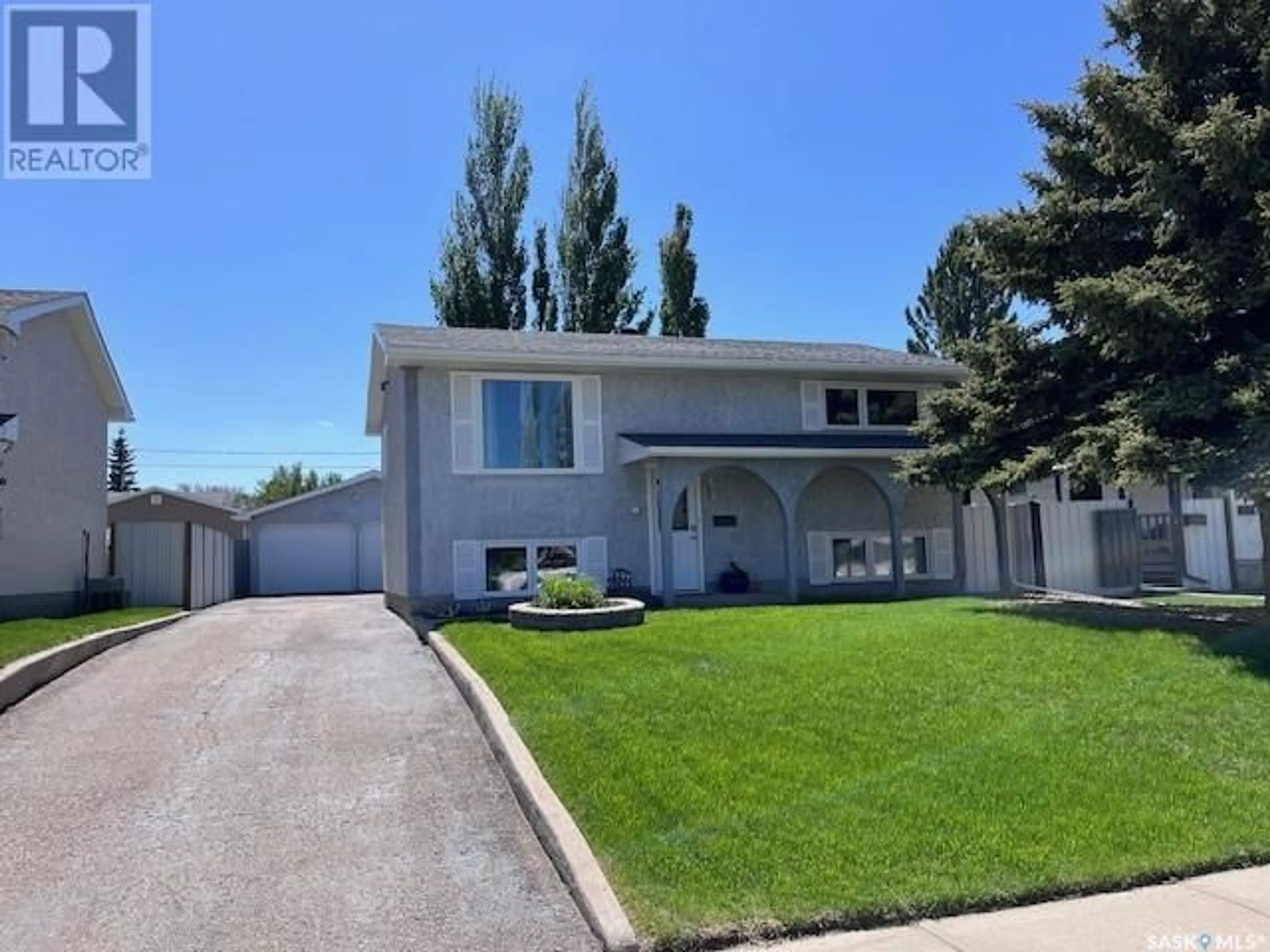 Home with vinyl exterior material, street for 1519 SMITH STREET, Moose Jaw Saskatchewan S6H6W7