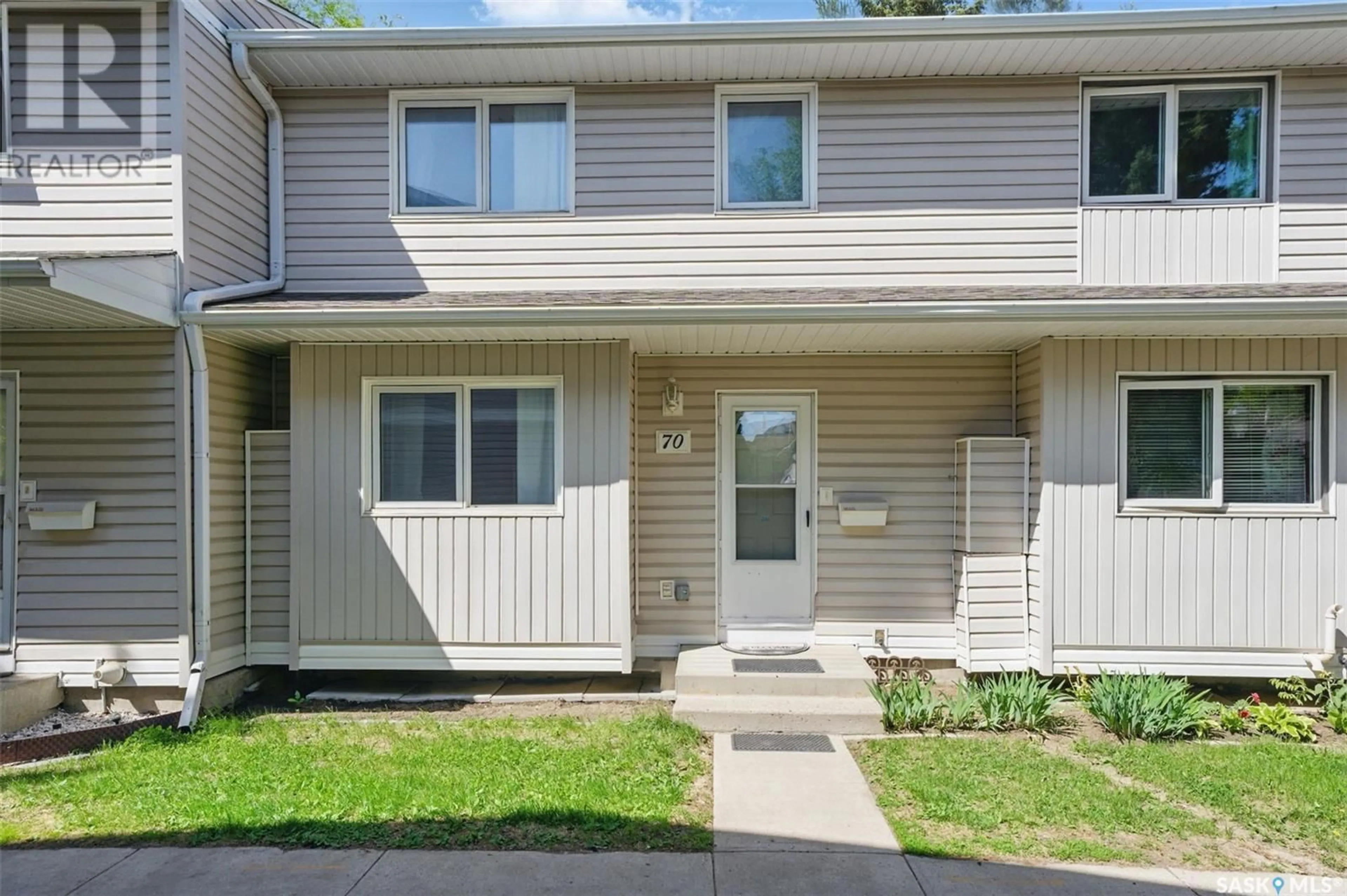 Home with vinyl exterior material, street for 70 330 HAIGHT CRESCENT, Saskatoon Saskatchewan S7H4V9