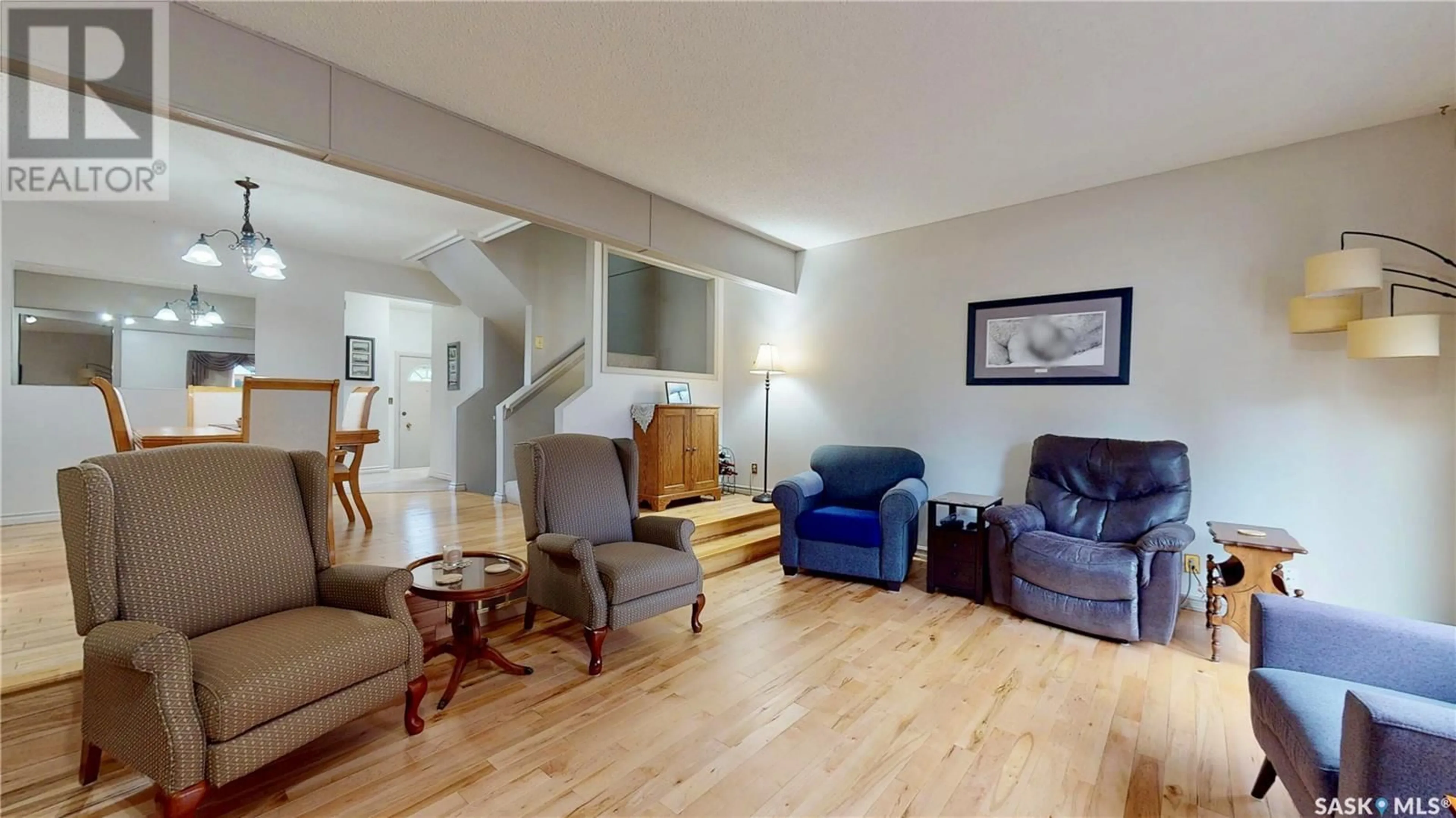 Living room with furniture, wood/laminate floor for 3903 GORDON ROAD, Regina Saskatchewan S4S6G6
