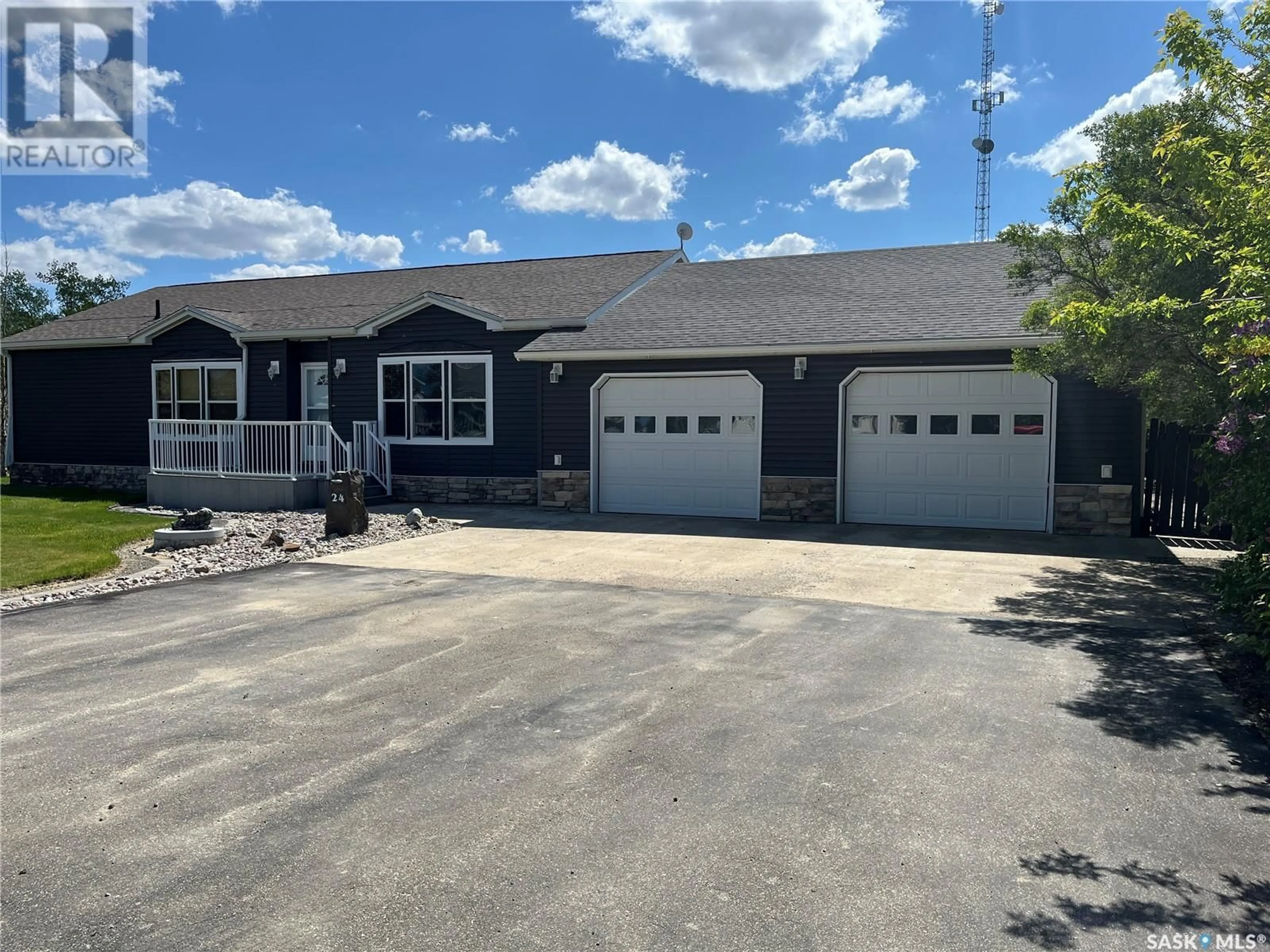 Home with vinyl exterior material, street for 24 HALL STREET, Halbrite Saskatchewan S0C1H0