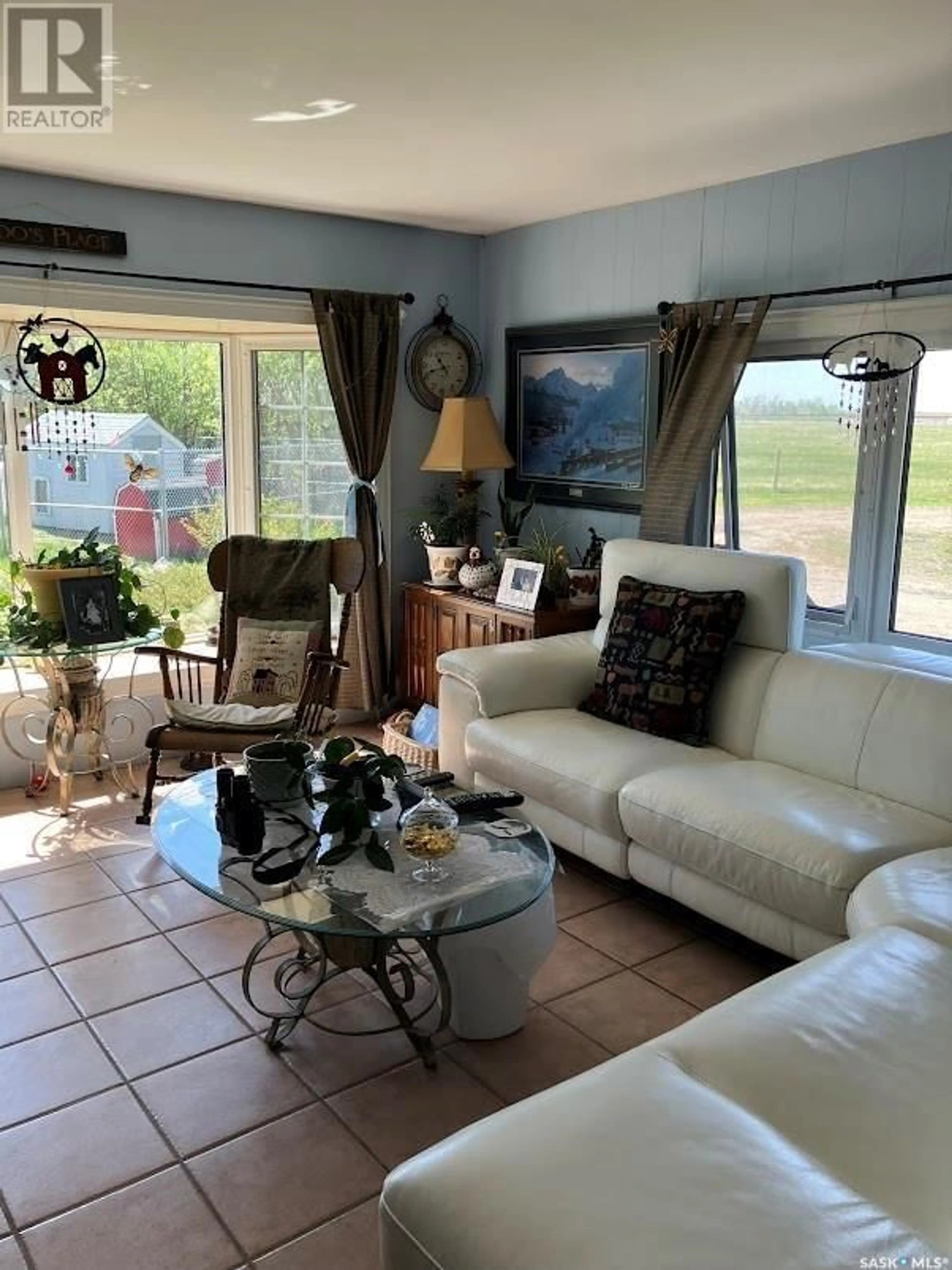 Living room with furniture, ceramic/tile floor for SARA ACREAGE, Stanley Rm No. 215 Saskatchewan S0A2P0