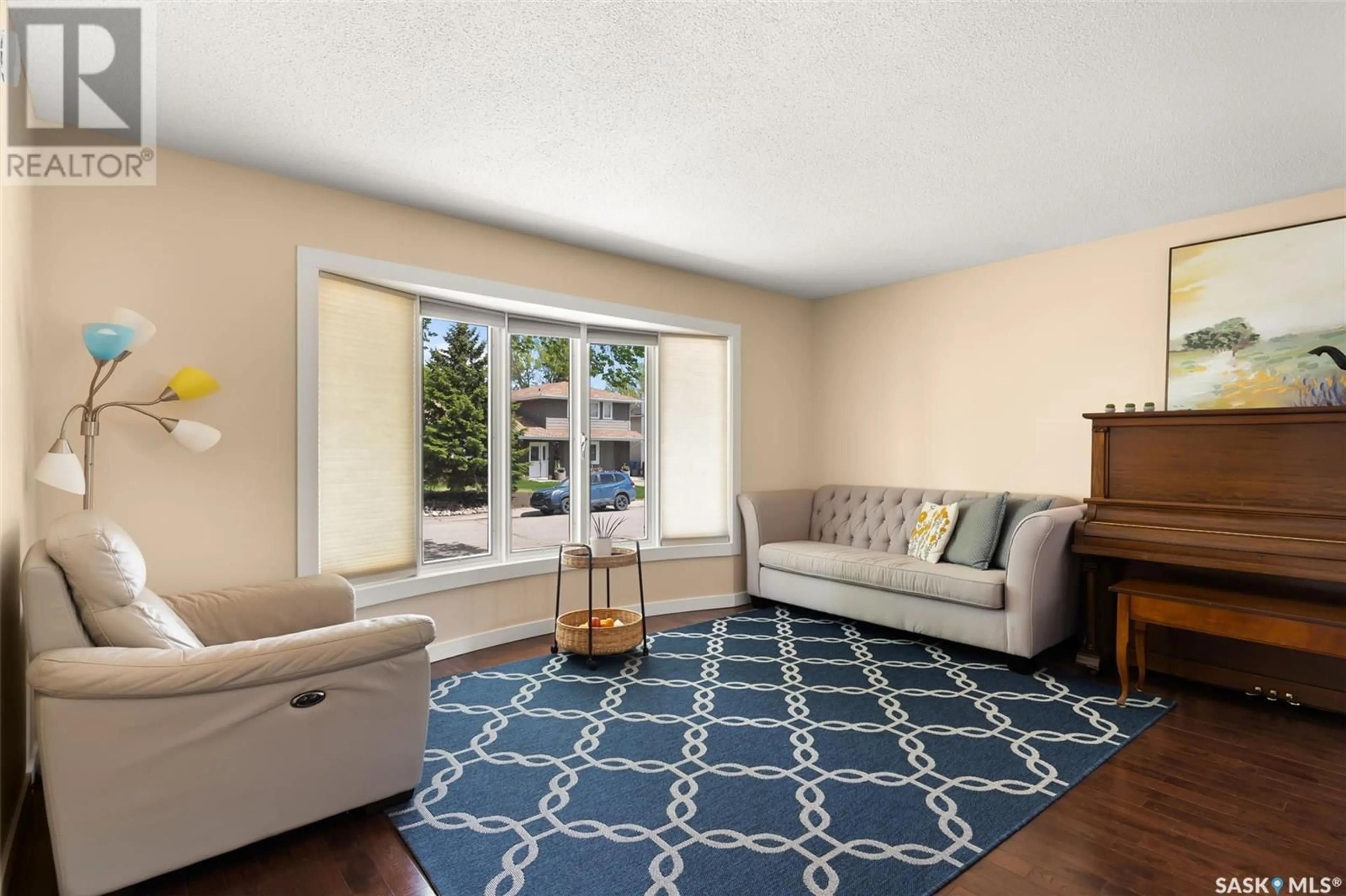 Living room with furniture, carpet floor for 47 LAUBACH AVENUE, Regina Saskatchewan S4S6C3