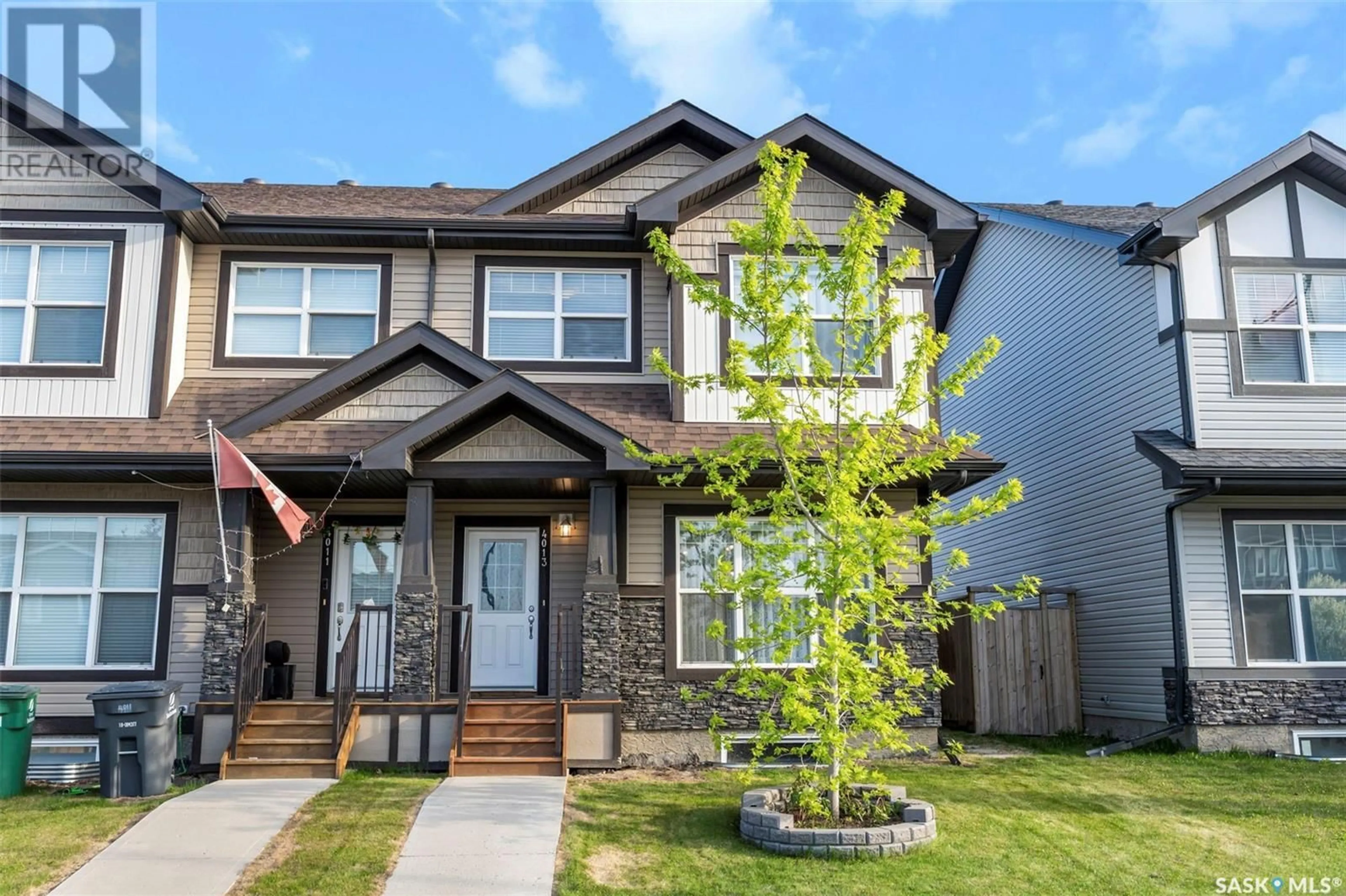 Home with brick exterior material, street for 4013 CENTENNIAL DRIVE, Saskatoon Saskatchewan S7L6R7