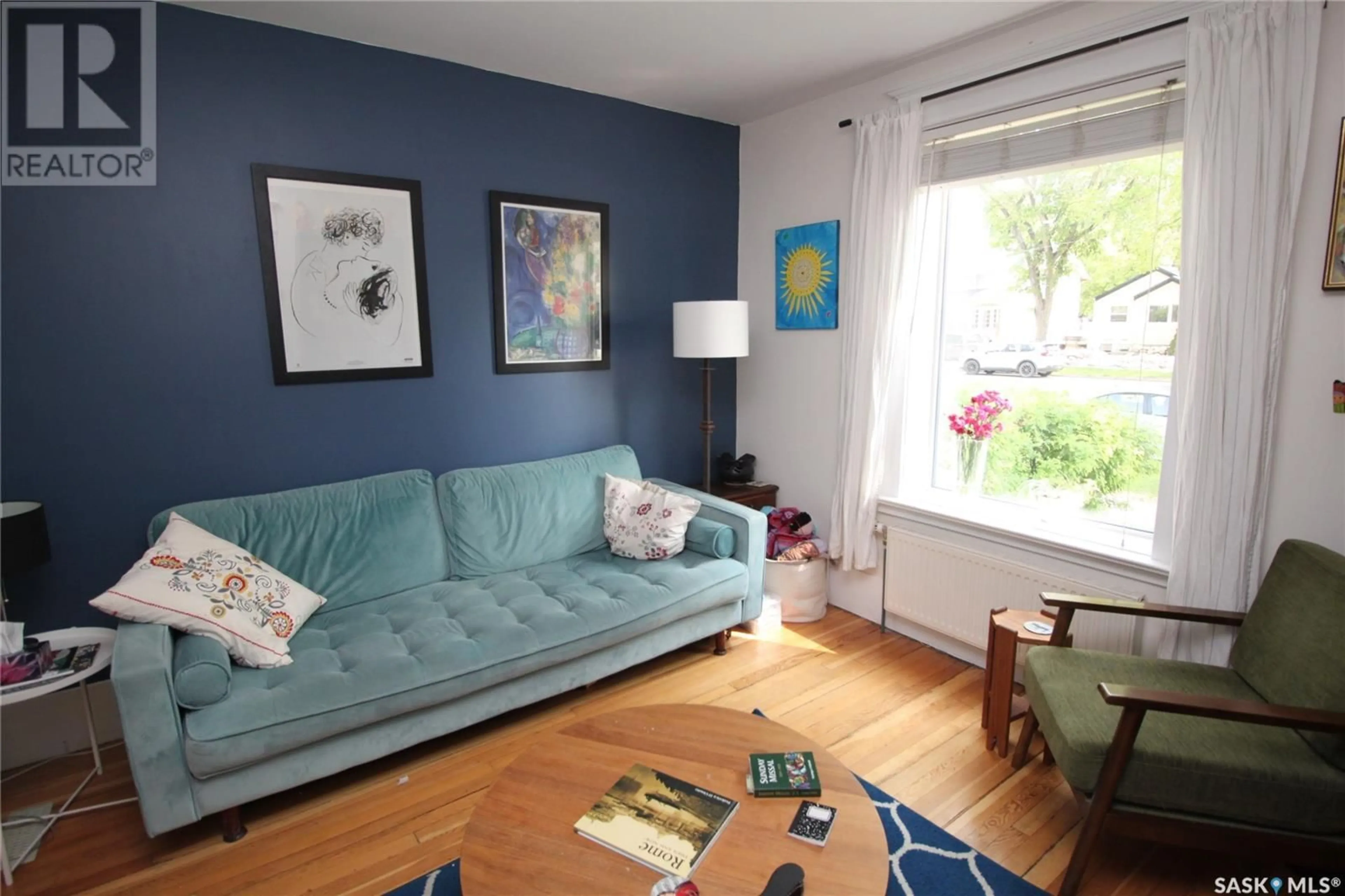 Living room with furniture, wood/laminate floor for 807 MAIN STREET, Saskatoon Saskatchewan S7H0K2