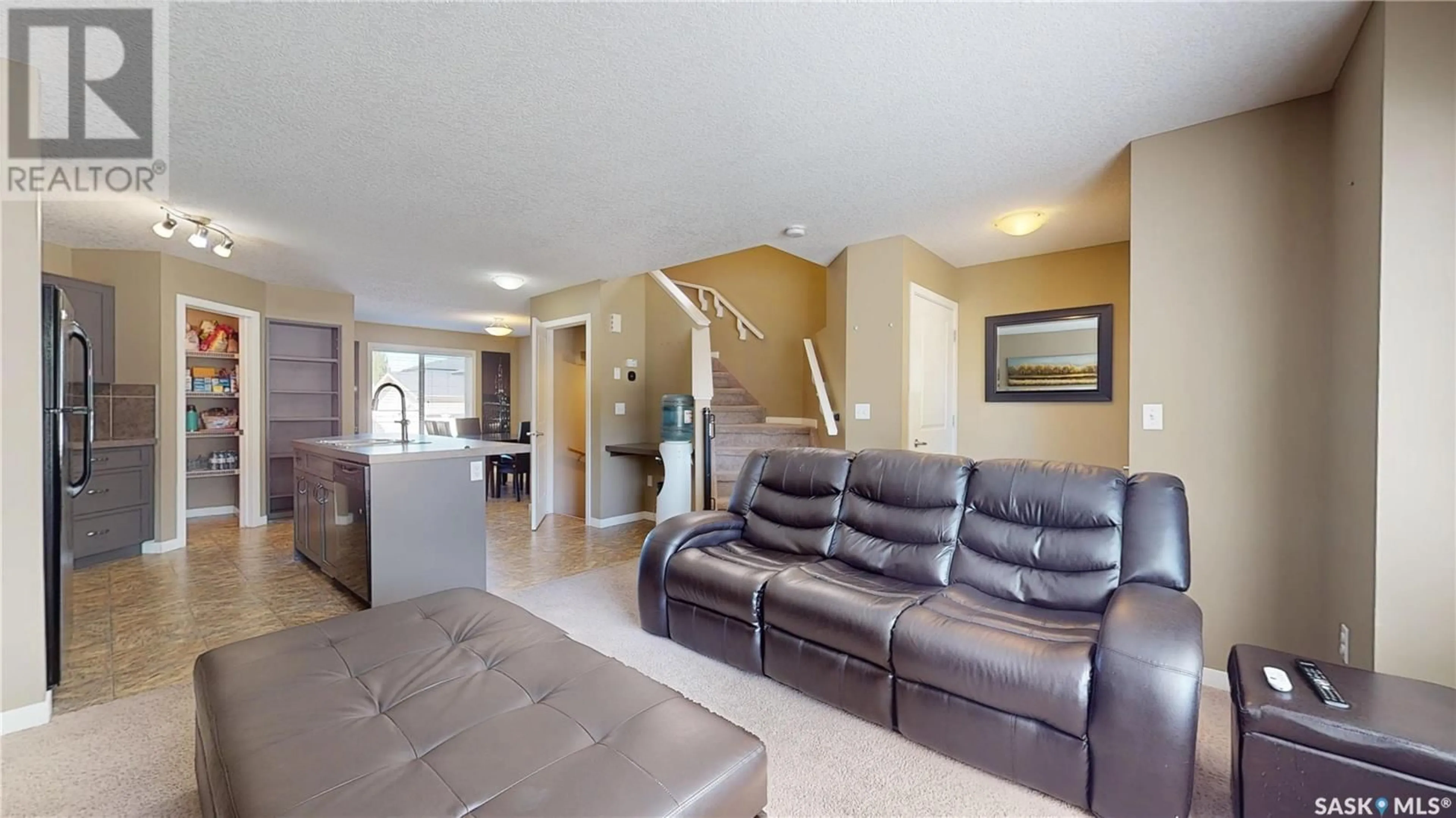 Living room with furniture, ceramic/tile floor for 5122 JIM CAIRNS BOULEVARD, Regina Saskatchewan S4W0E9