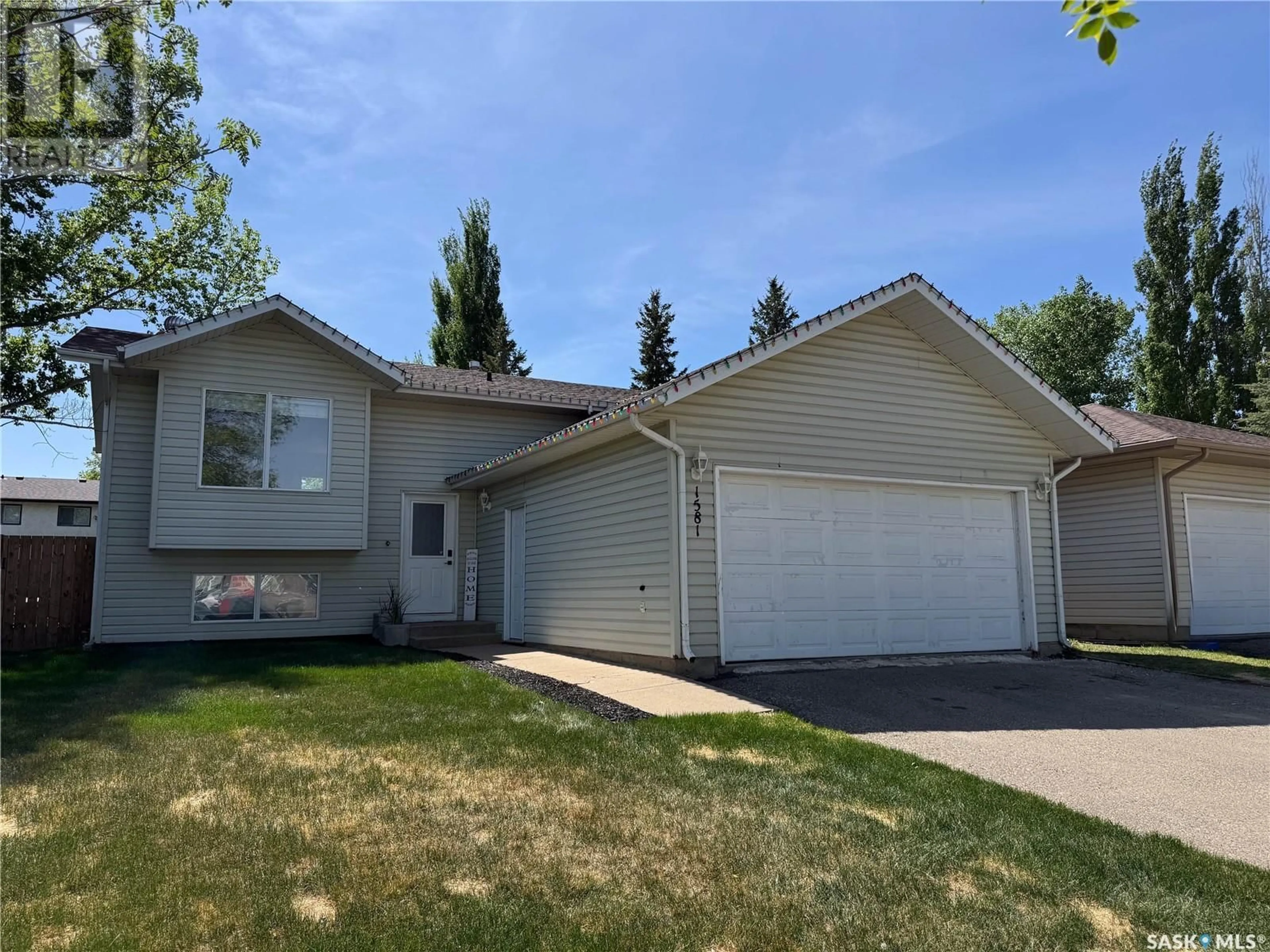Home with vinyl exterior material, street for 1581 OLIVE DIEFENBAKER DRIVE, Prince Albert Saskatchewan S6V7M5