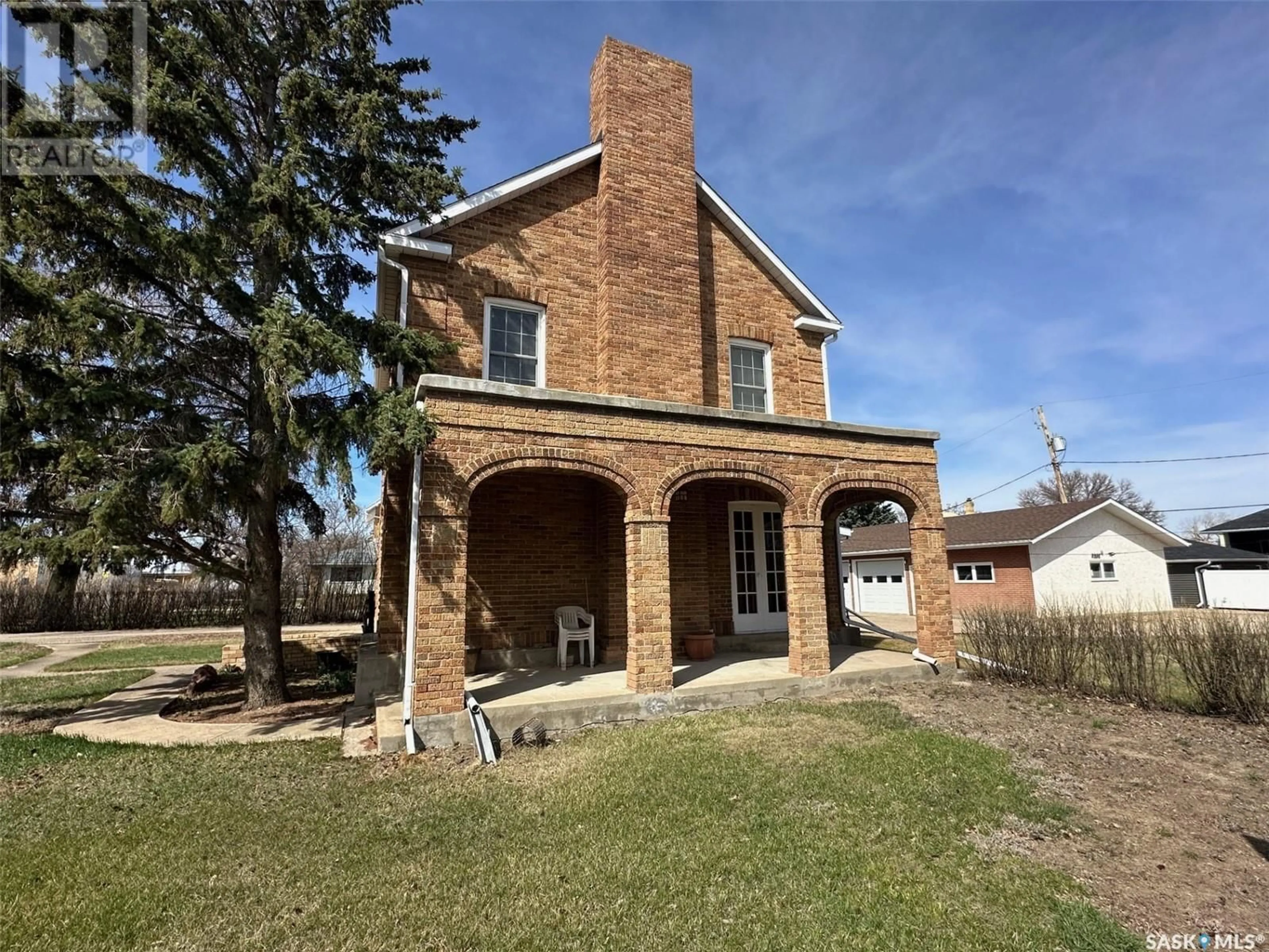 Home with brick exterior material, building for 107 1ST AVENUE, Gravelbourg Saskatchewan S0H1X0