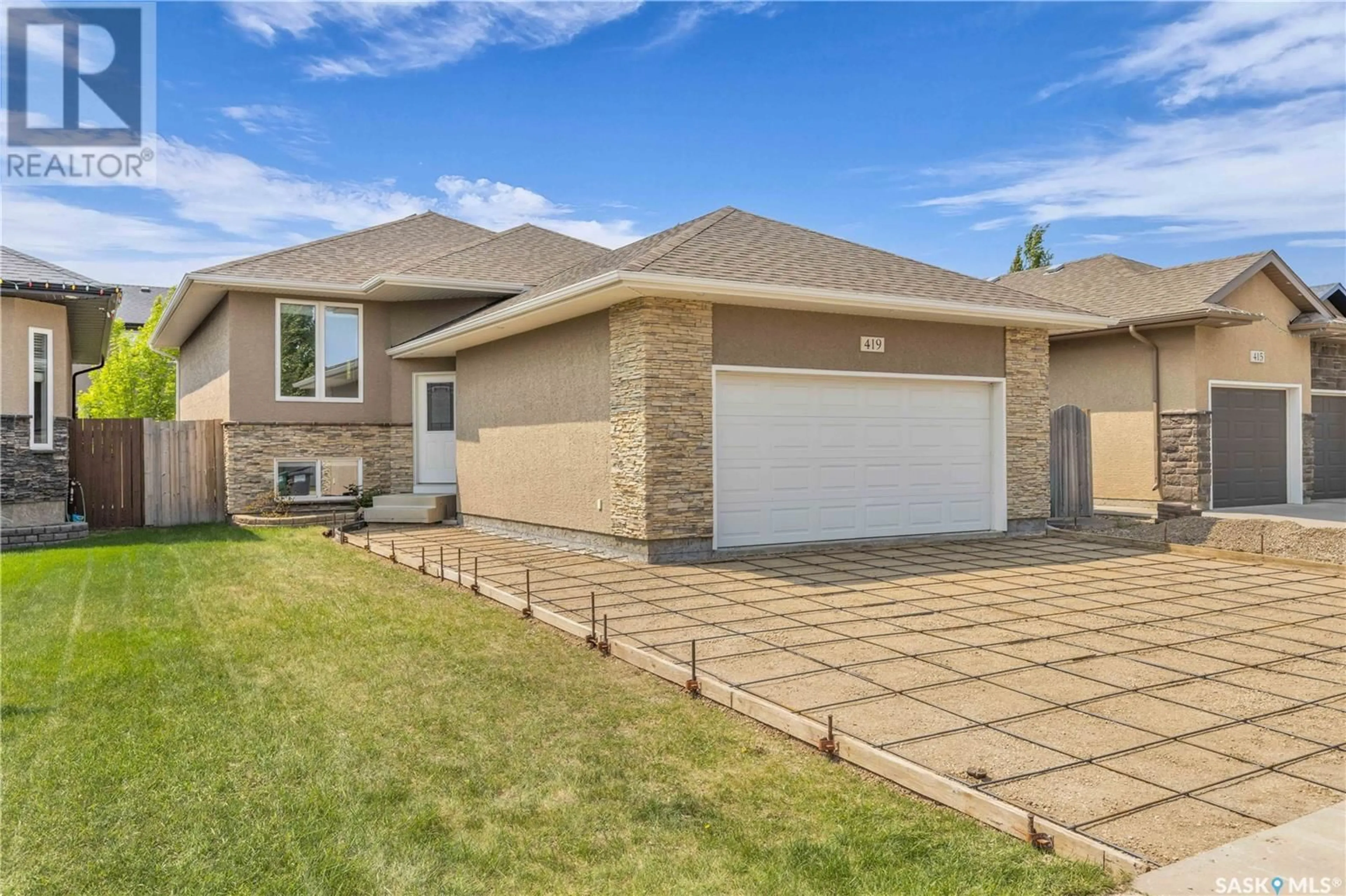 Home with brick exterior material, street for 419 REMPEL LANE, Saskatoon Saskatchewan S7T0J3