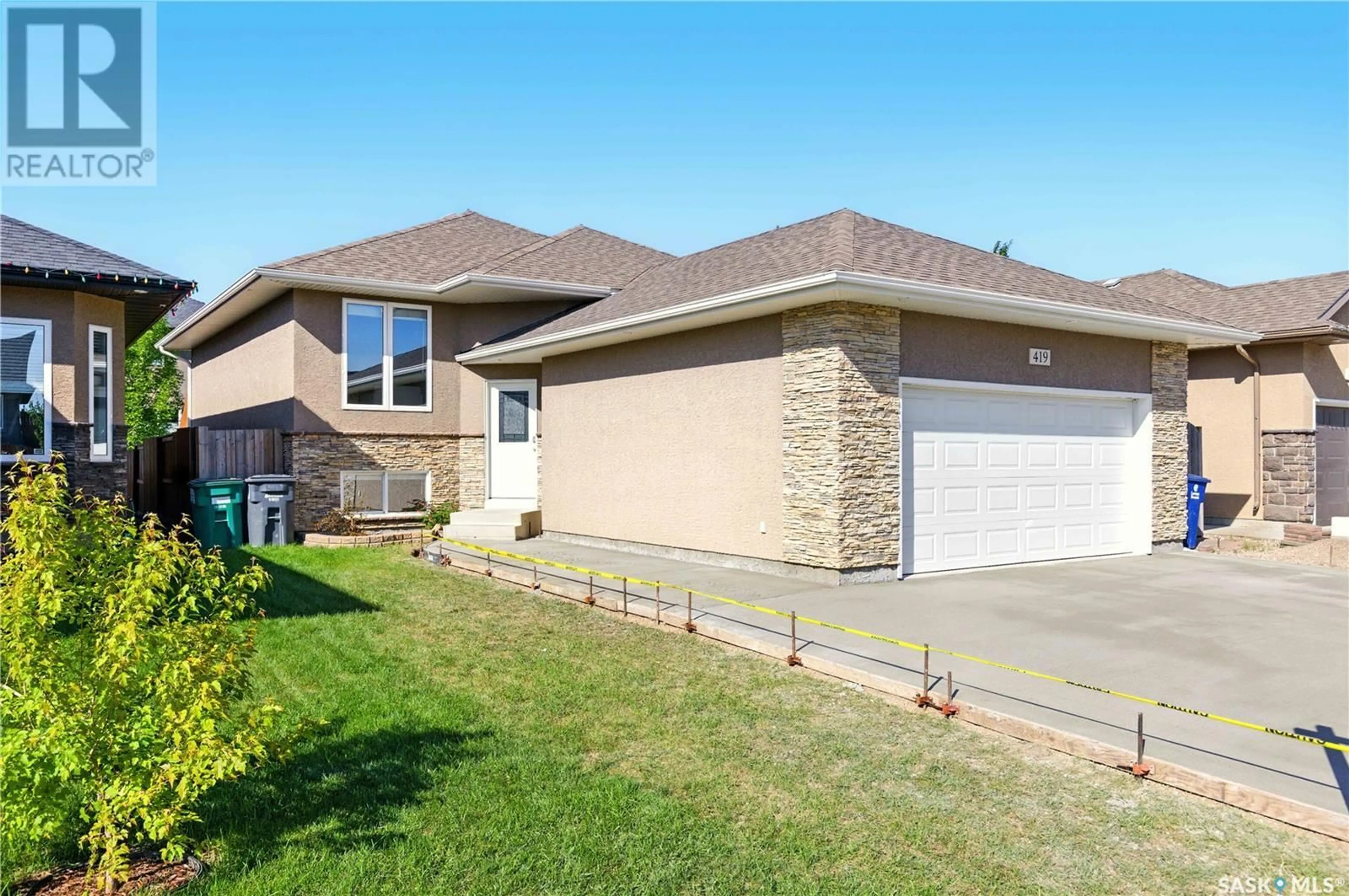 Home with brick exterior material, street for 419 REMPEL LANE, Saskatoon Saskatchewan S7T0J3