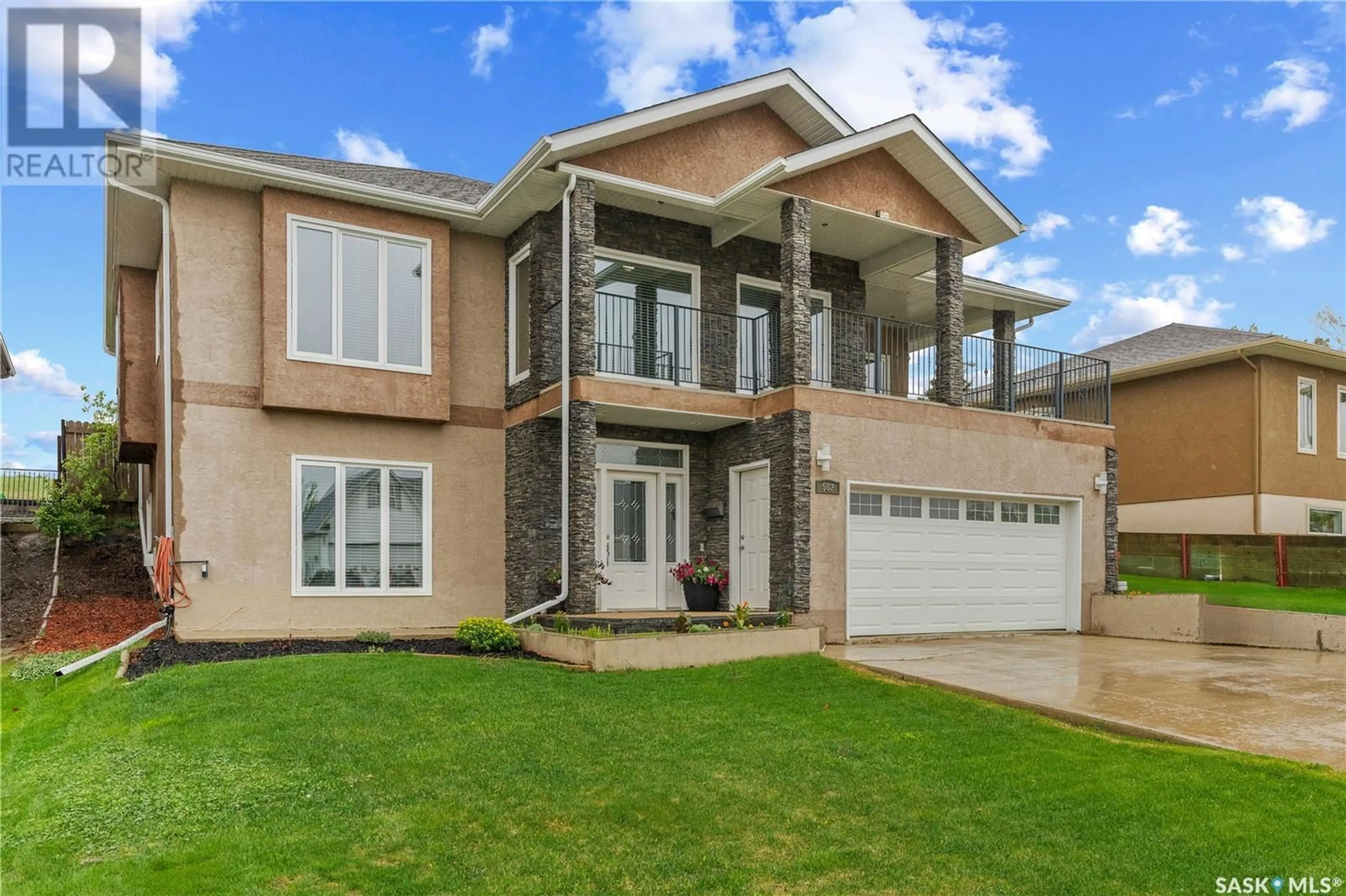 Home with brick exterior material, street for 502 ASPEN DRIVE, Swift Current Saskatchewan S9H5E4