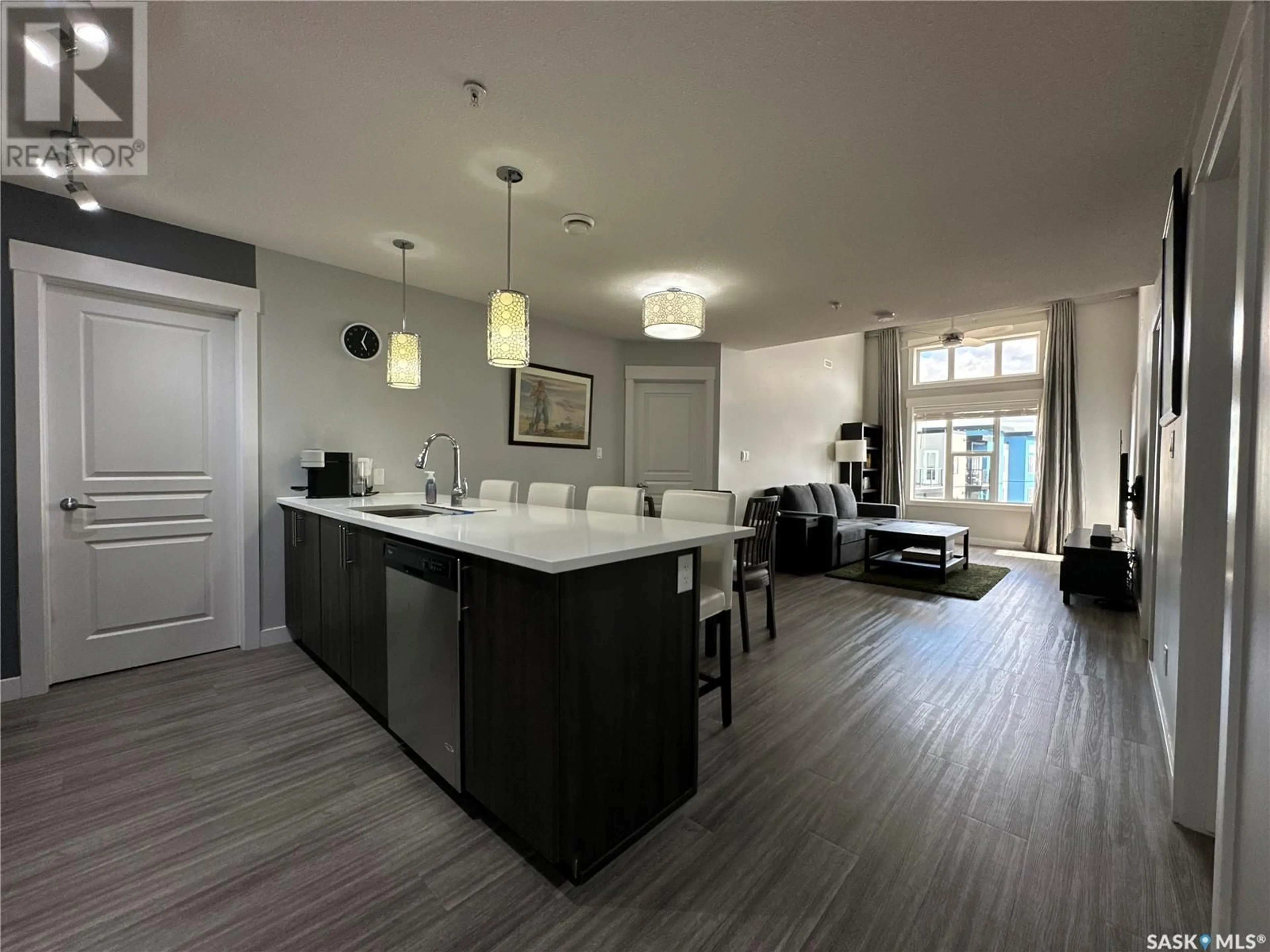 Open concept kitchen, wood/laminate floor for 424 - 5301 UNIVERSAL CRESCENT, Regina Saskatchewan S4W0K6