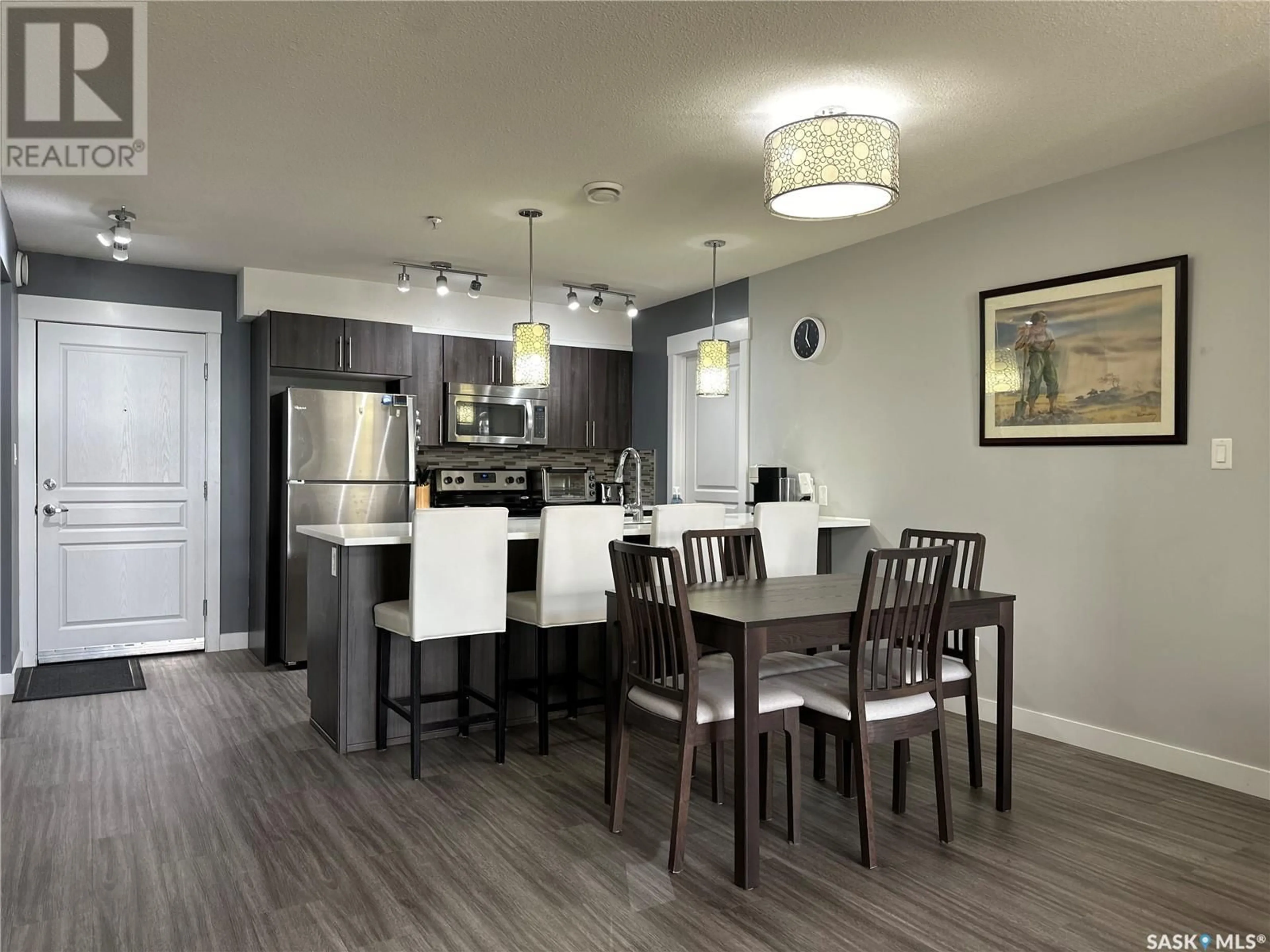 Open concept kitchen, wood/laminate floor for 424 - 5301 UNIVERSAL CRESCENT, Regina Saskatchewan S4W0K6