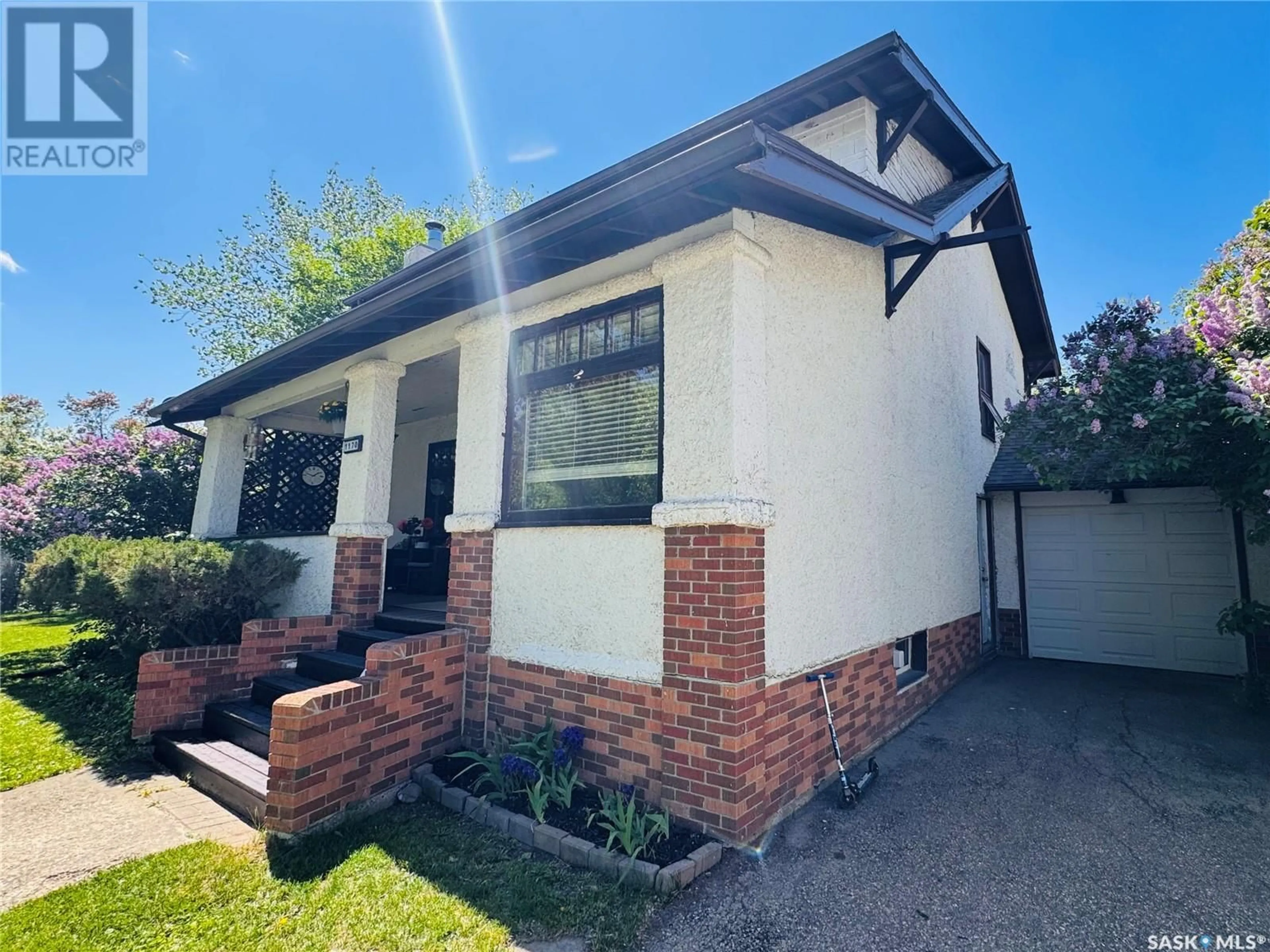 Home with brick exterior material, street for 1170 CLIFTON AVENUE, Moose Jaw Saskatchewan S6H3L5