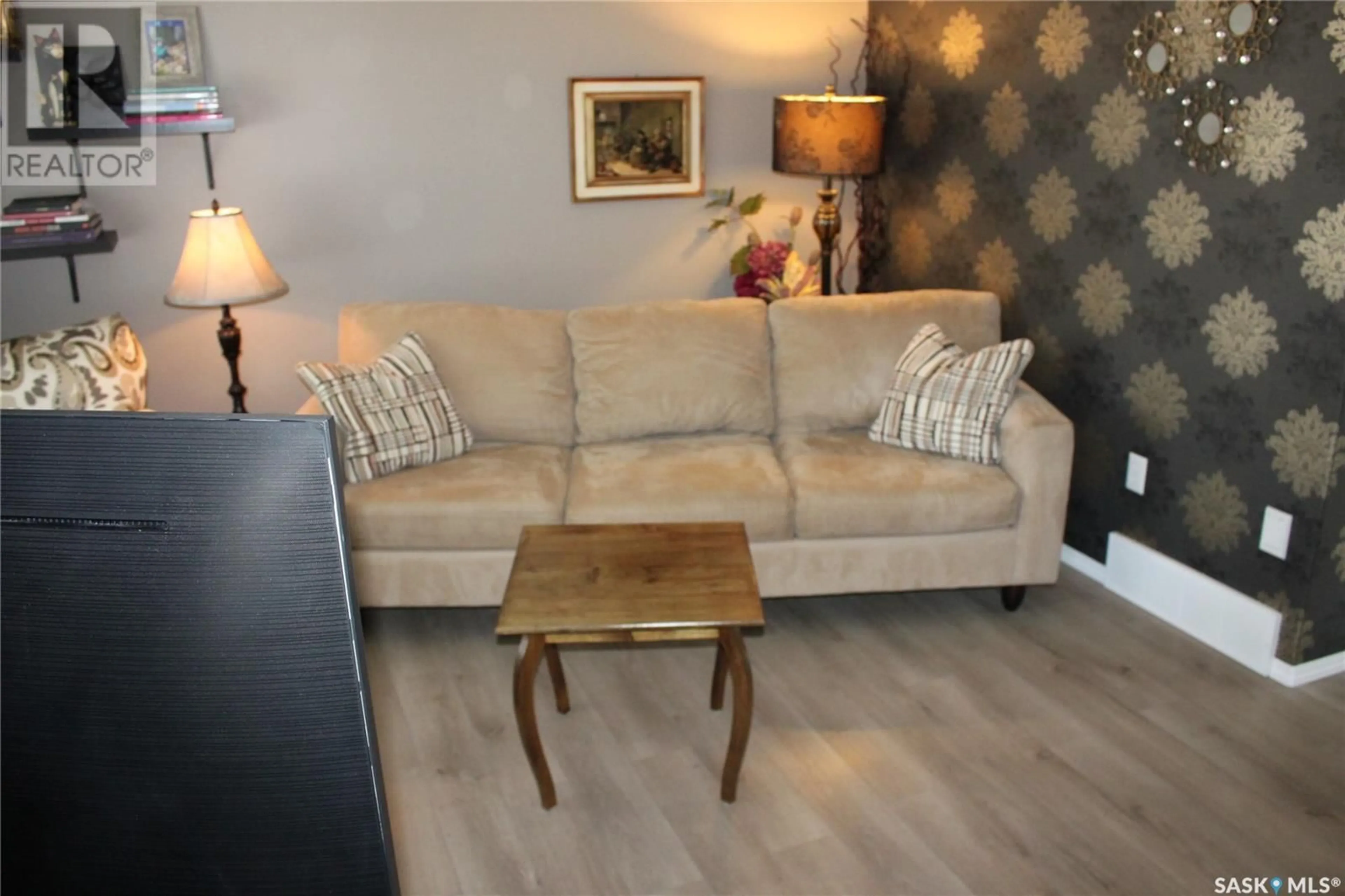 Living room with furniture, wood/laminate floor for 4658 MARIGOLD DRIVE, Regina Saskatchewan S4X4S5
