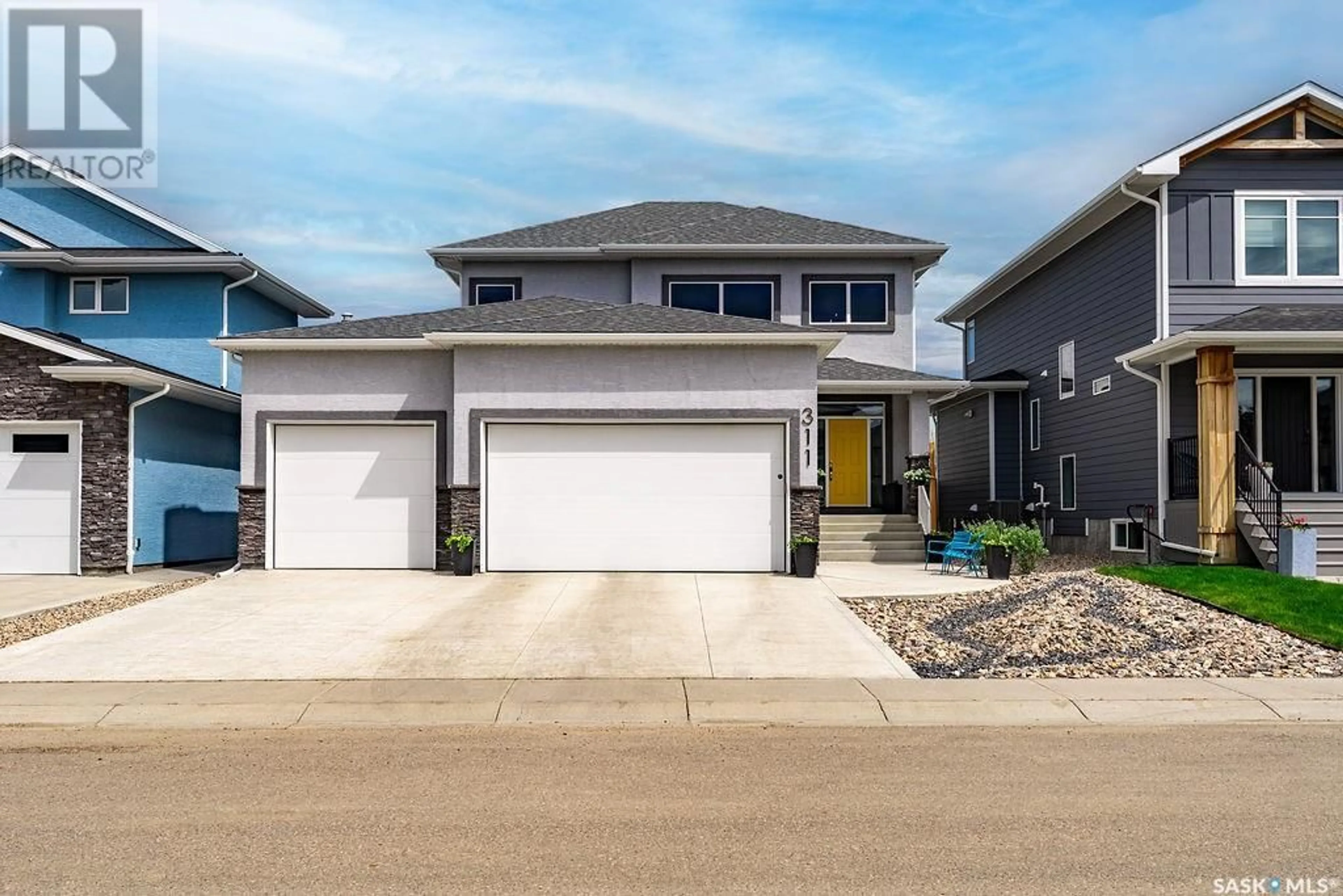 Home with vinyl exterior material, street for 311 HAMM WAY, Saskatoon Saskatchewan S7V0W2