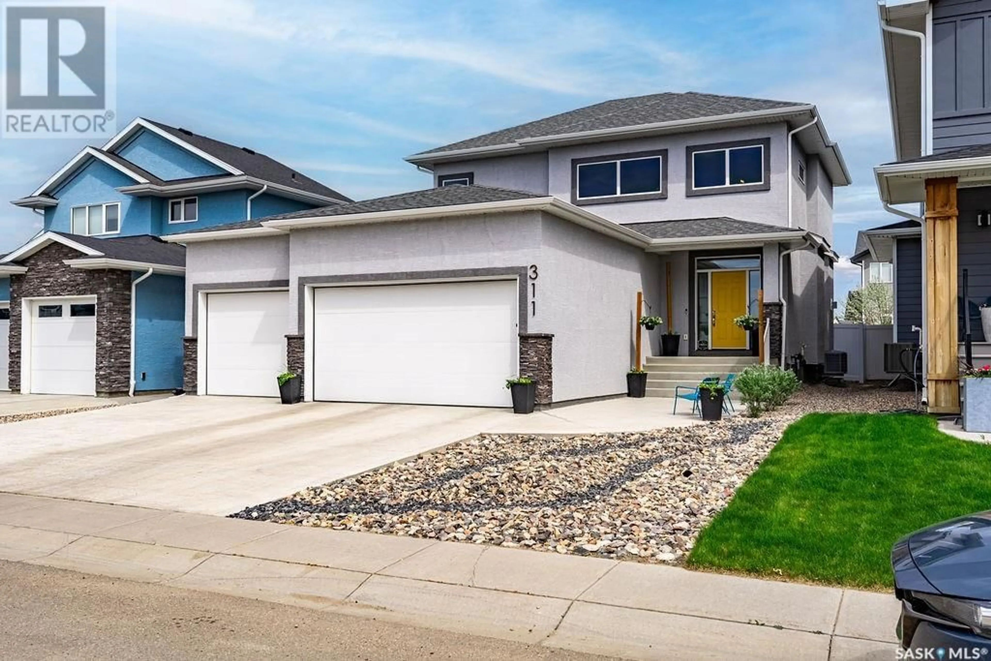 Home with vinyl exterior material, street for 311 HAMM WAY, Saskatoon Saskatchewan S7V0W2