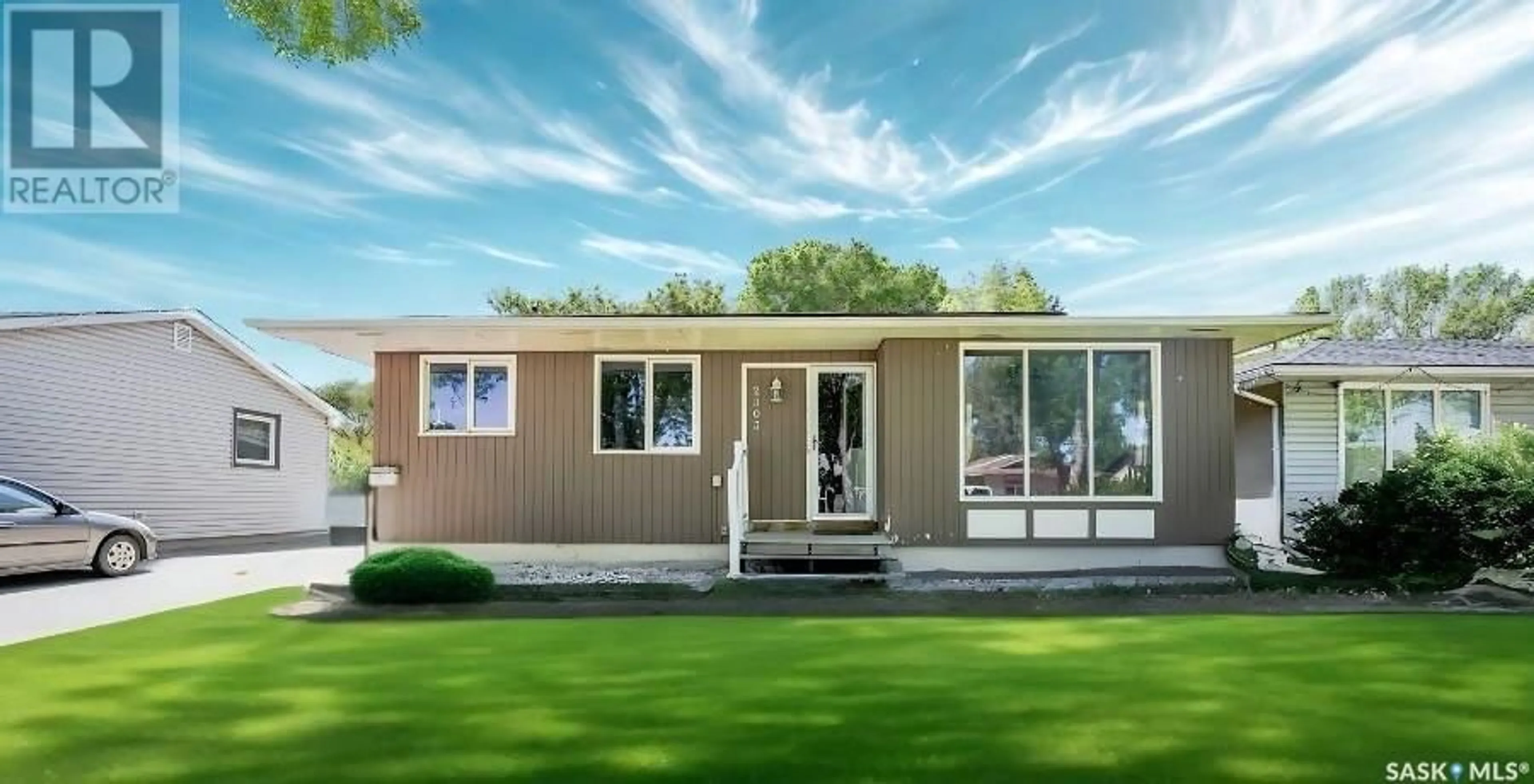 Home with vinyl exterior material, street for 2303 7TH AVENUE E, Regina Saskatchewan S4N4T1