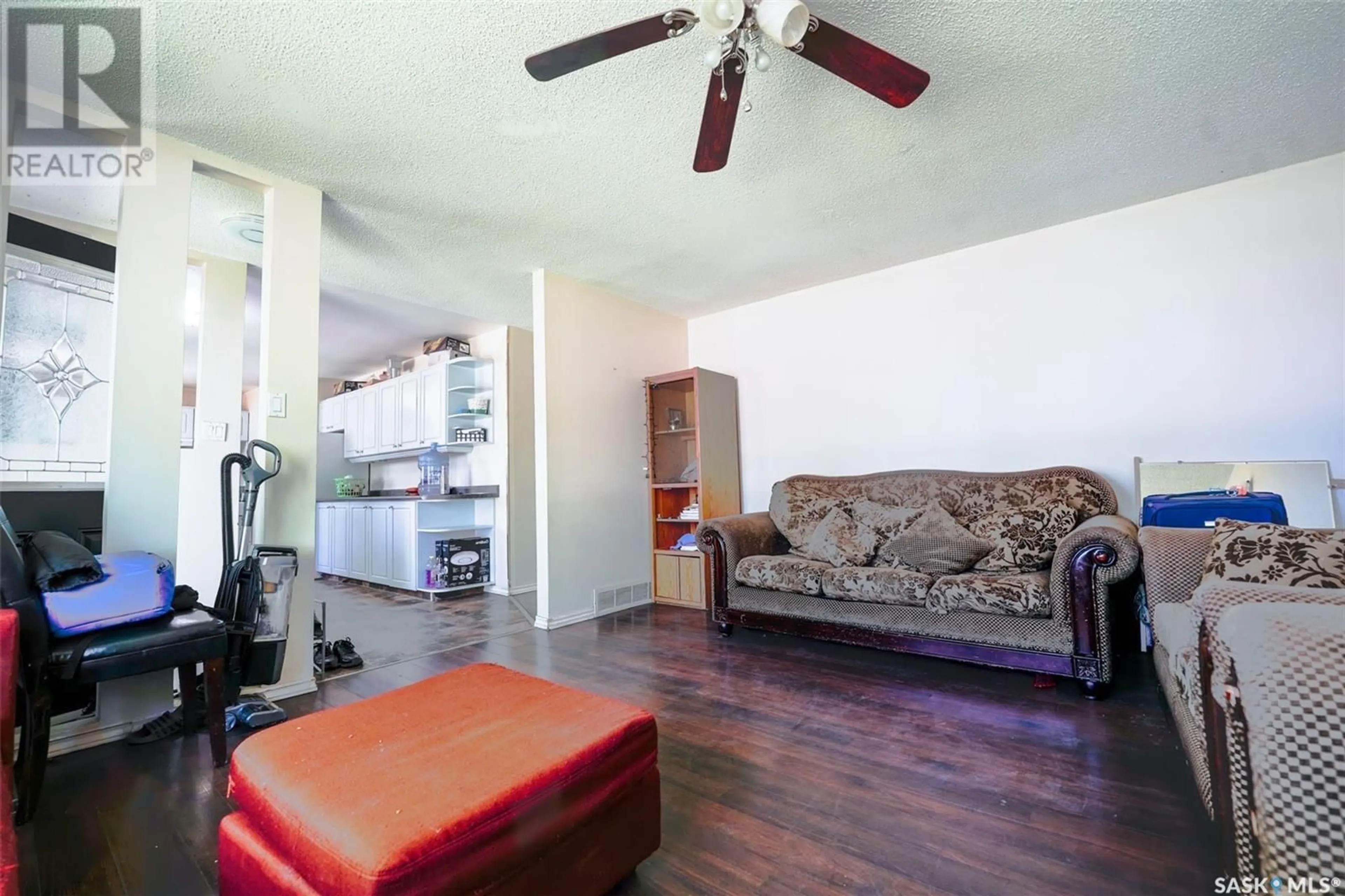 Living room with furniture, wood/laminate floor for 2303 7TH AVENUE E, Regina Saskatchewan S4N4T1