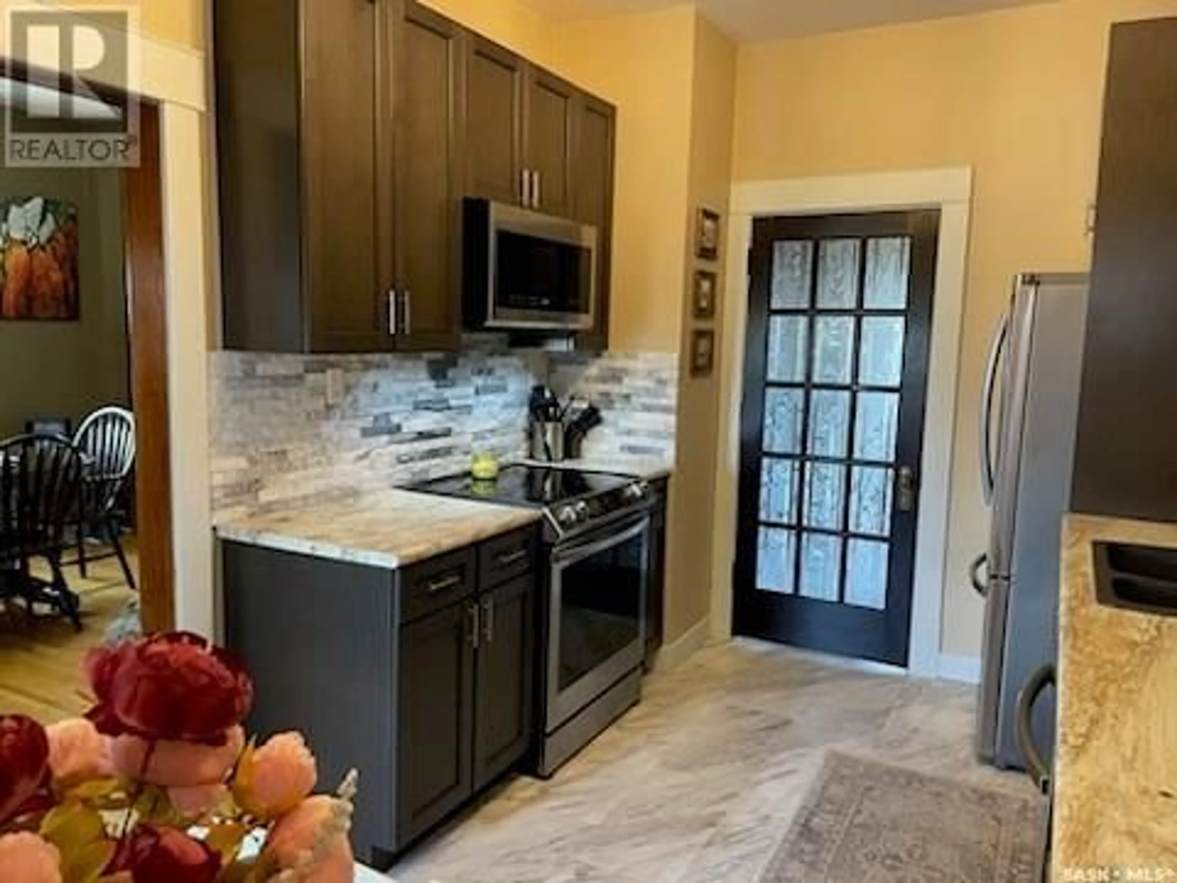 Open concept kitchen, ceramic/tile floor for 130 2ND STREET, Kincaid Saskatchewan S0H2J0