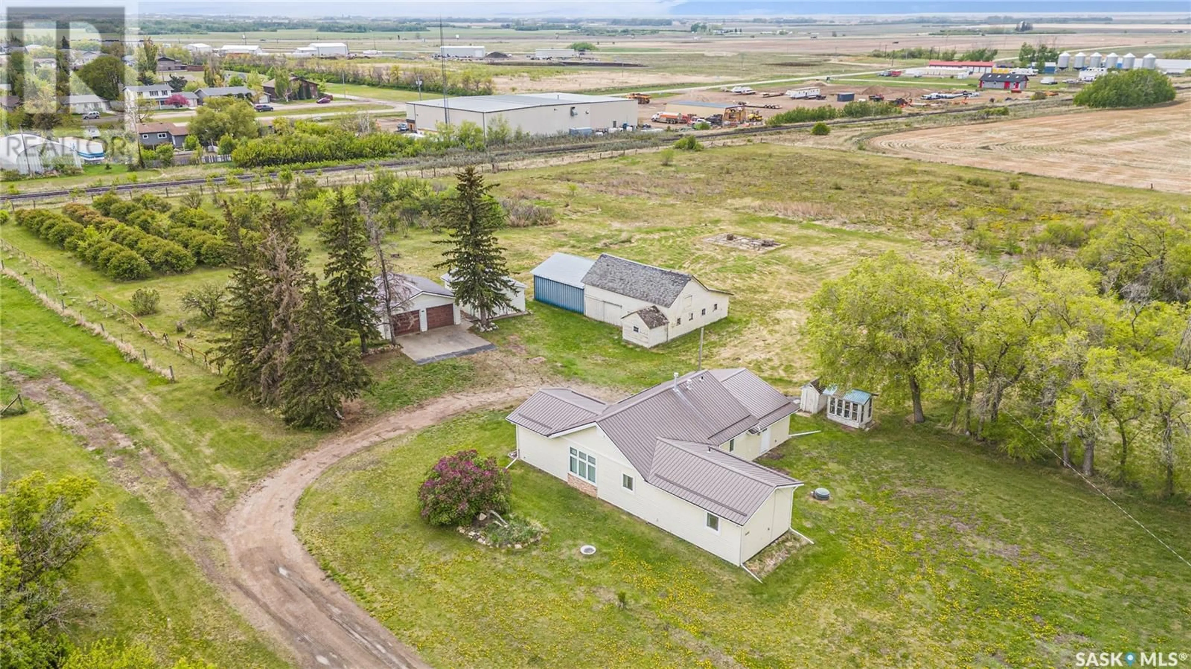 A pic from outside/outdoor area/front of a property/back of a property/a pic from drone, water/lake/river/ocean view for 112 DEKKER STREET, Langham Saskatchewan S0K2L0