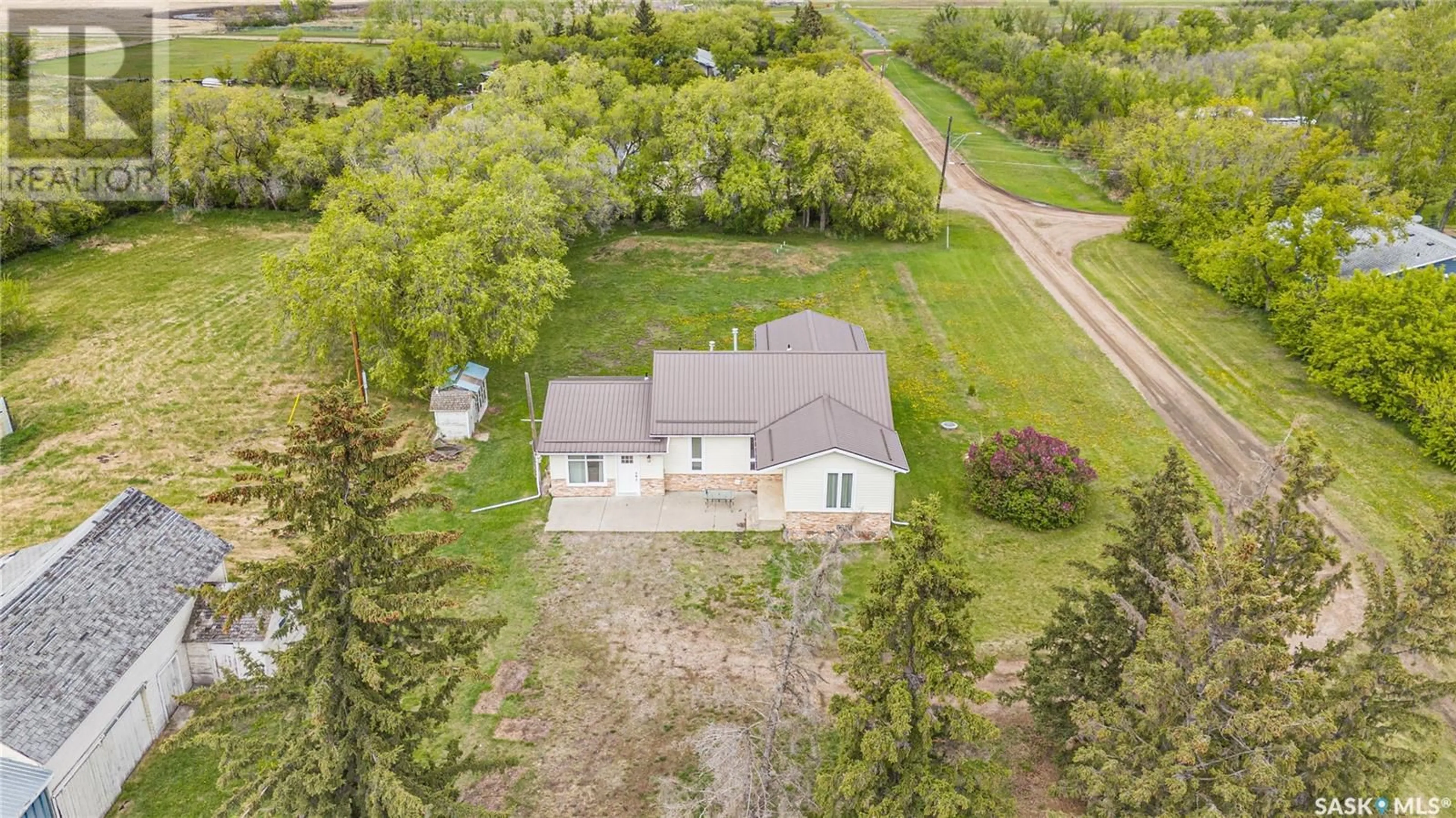 A pic from outside/outdoor area/front of a property/back of a property/a pic from drone, unknown for 112 DEKKER STREET, Langham Saskatchewan S0K2L0