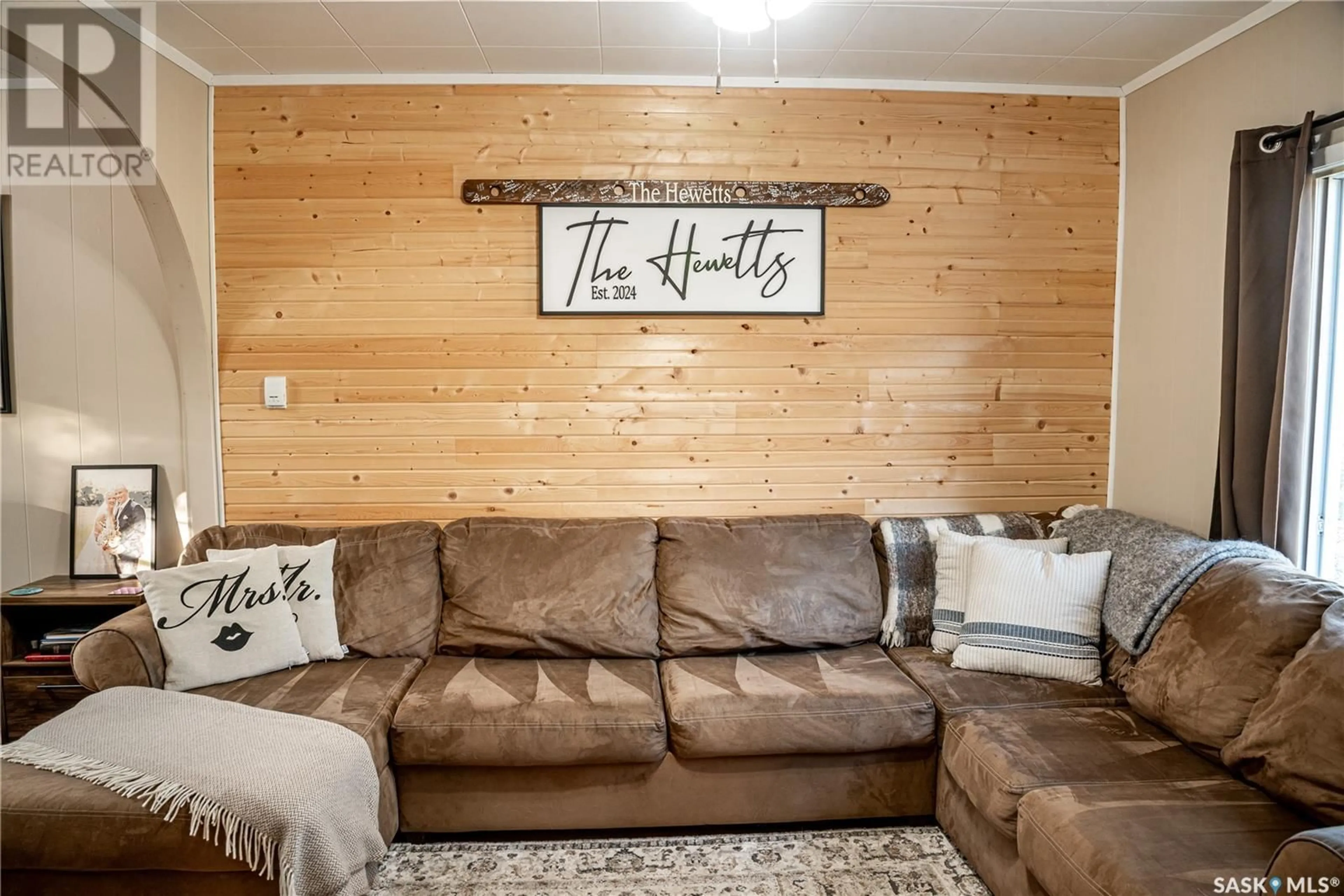 Living room with furniture, wood/laminate floor for 109 4TH AVENUE, Big River Saskatchewan S0J0E0