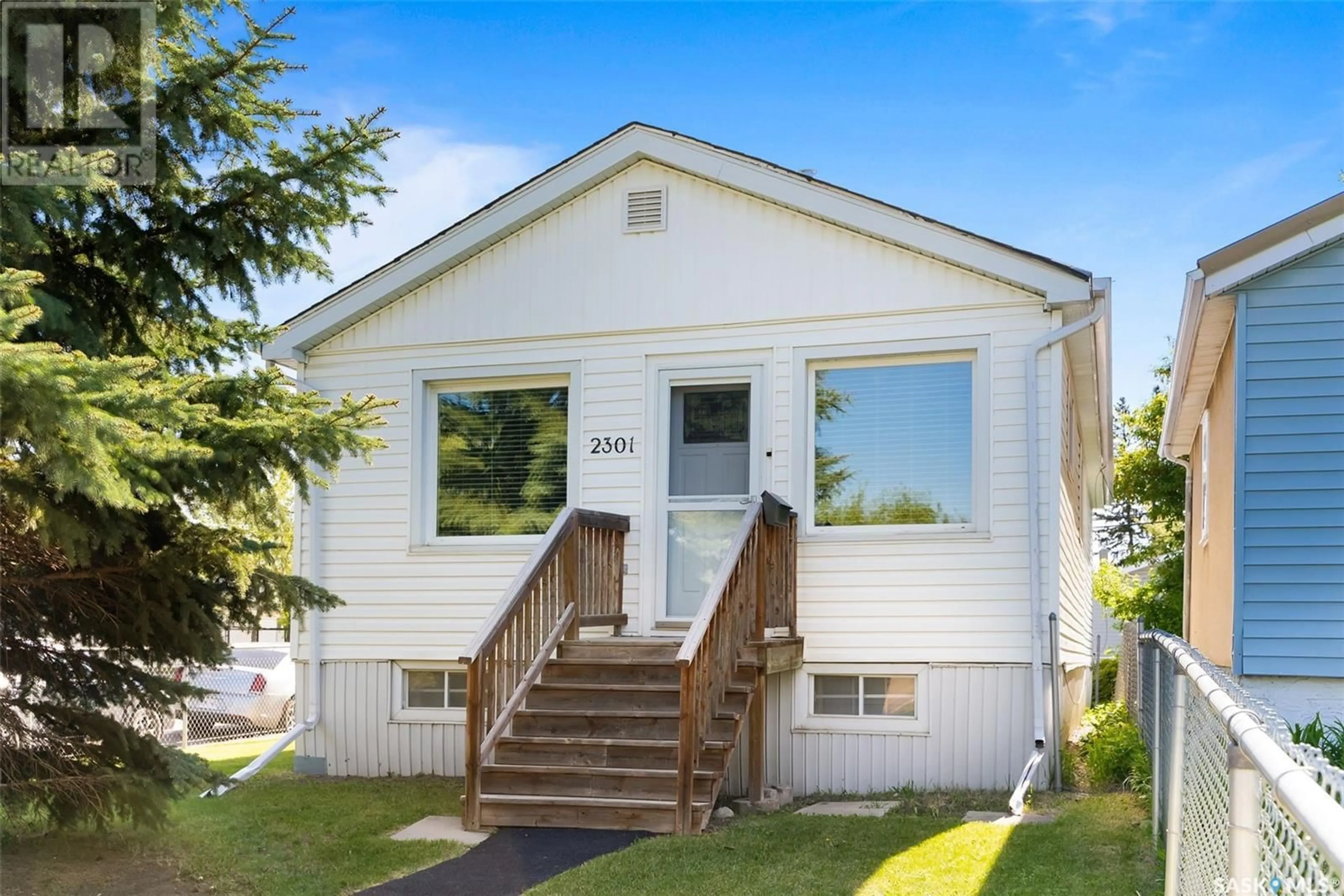 Home with vinyl exterior material, street for 2301 FRANCIS STREET, Regina Saskatchewan S4N2P8