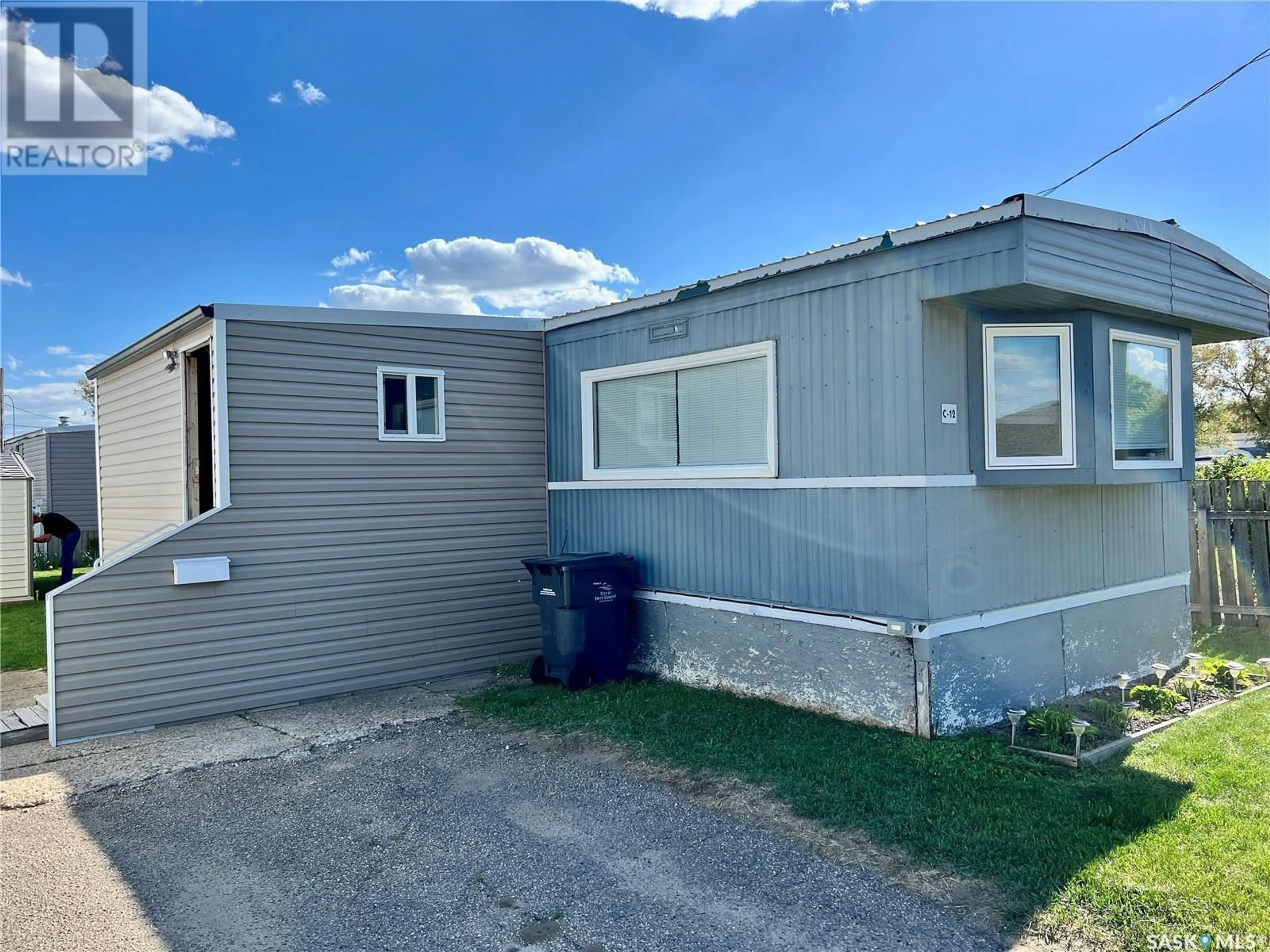 Home with vinyl exterior material, street for C-12 - 73 ROBERT STREET, Swift Current Saskatchewan S9H3S8