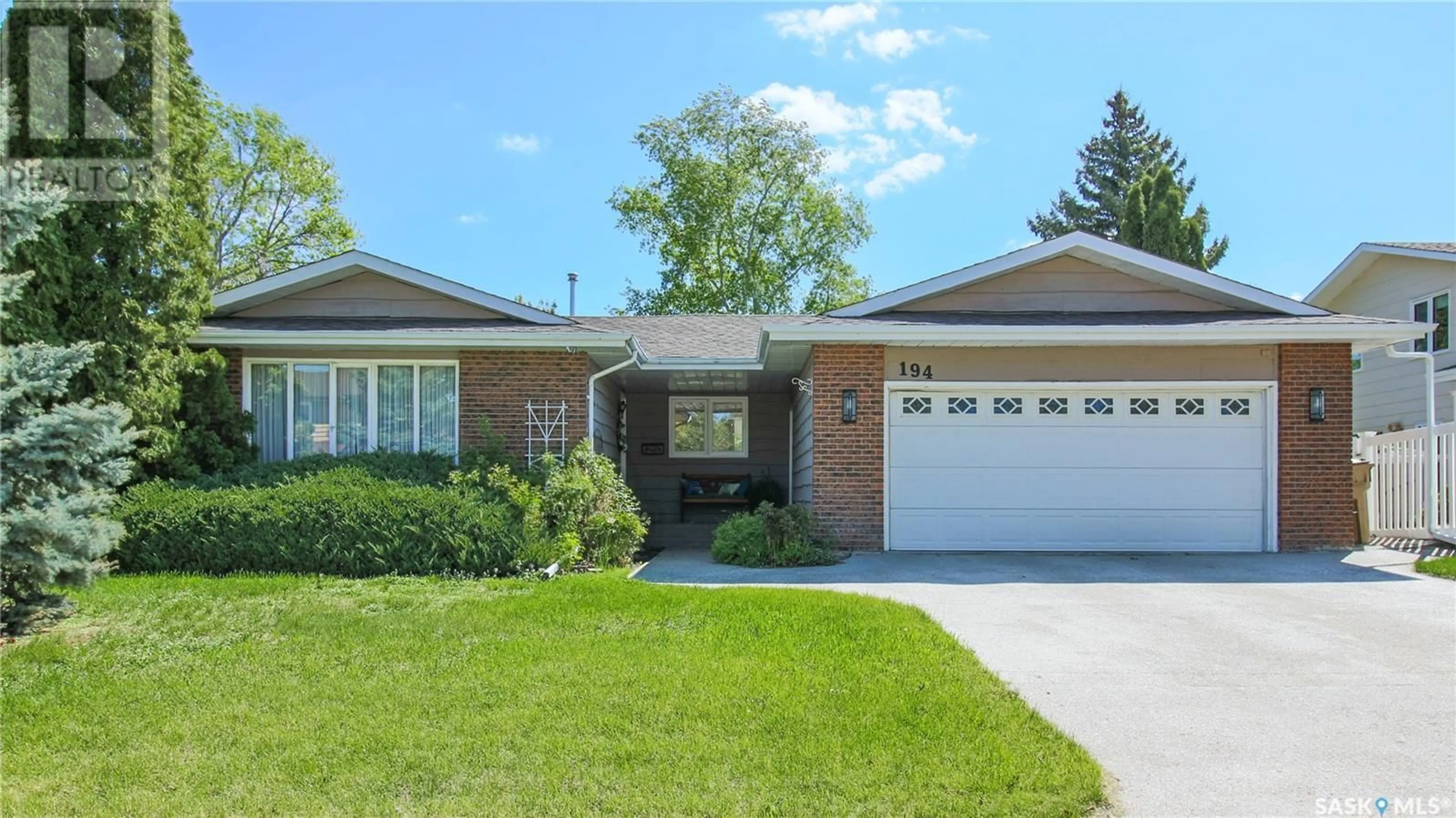 Home with brick exterior material, street for 194 GREEN MEADOW ROAD, Regina Saskatchewan S4V0A9
