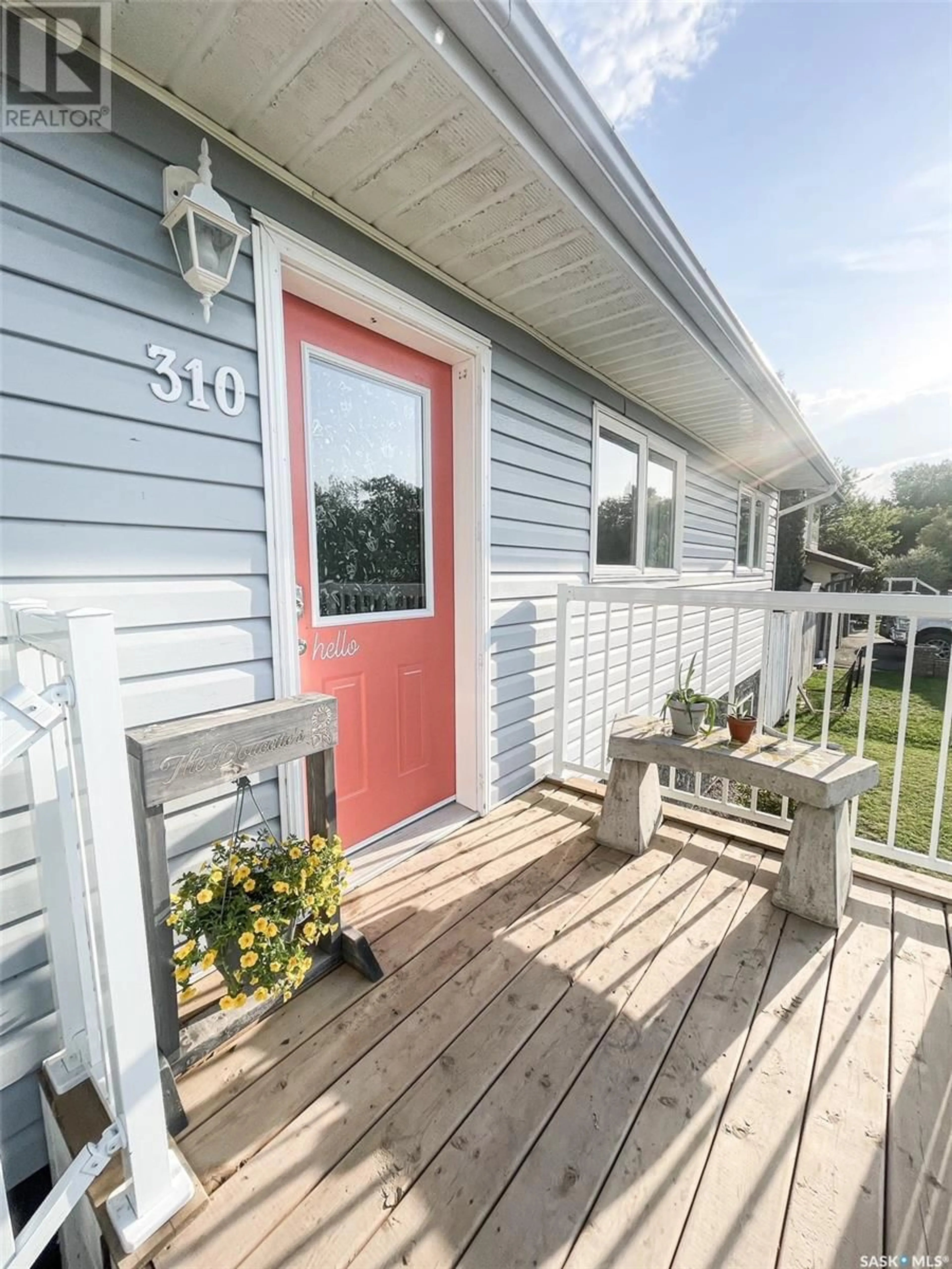 Home with vinyl exterior material, street for 310 WOODMAN AVENUE, Meadow Lake Saskatchewan S9X1H3