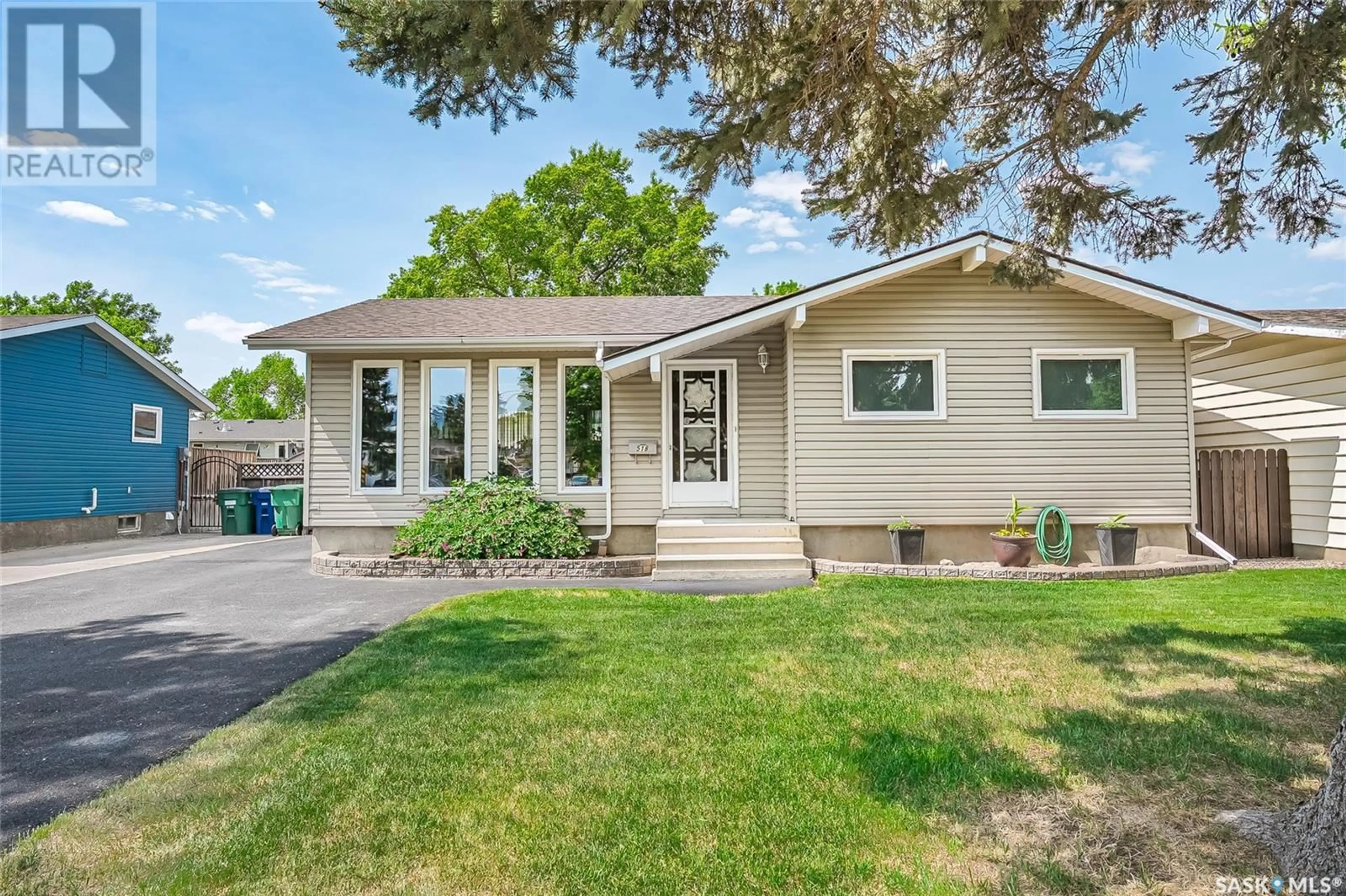 Home with vinyl exterior material, street for 518 FORRESTER ROAD, Saskatoon Saskatchewan S7M4G6