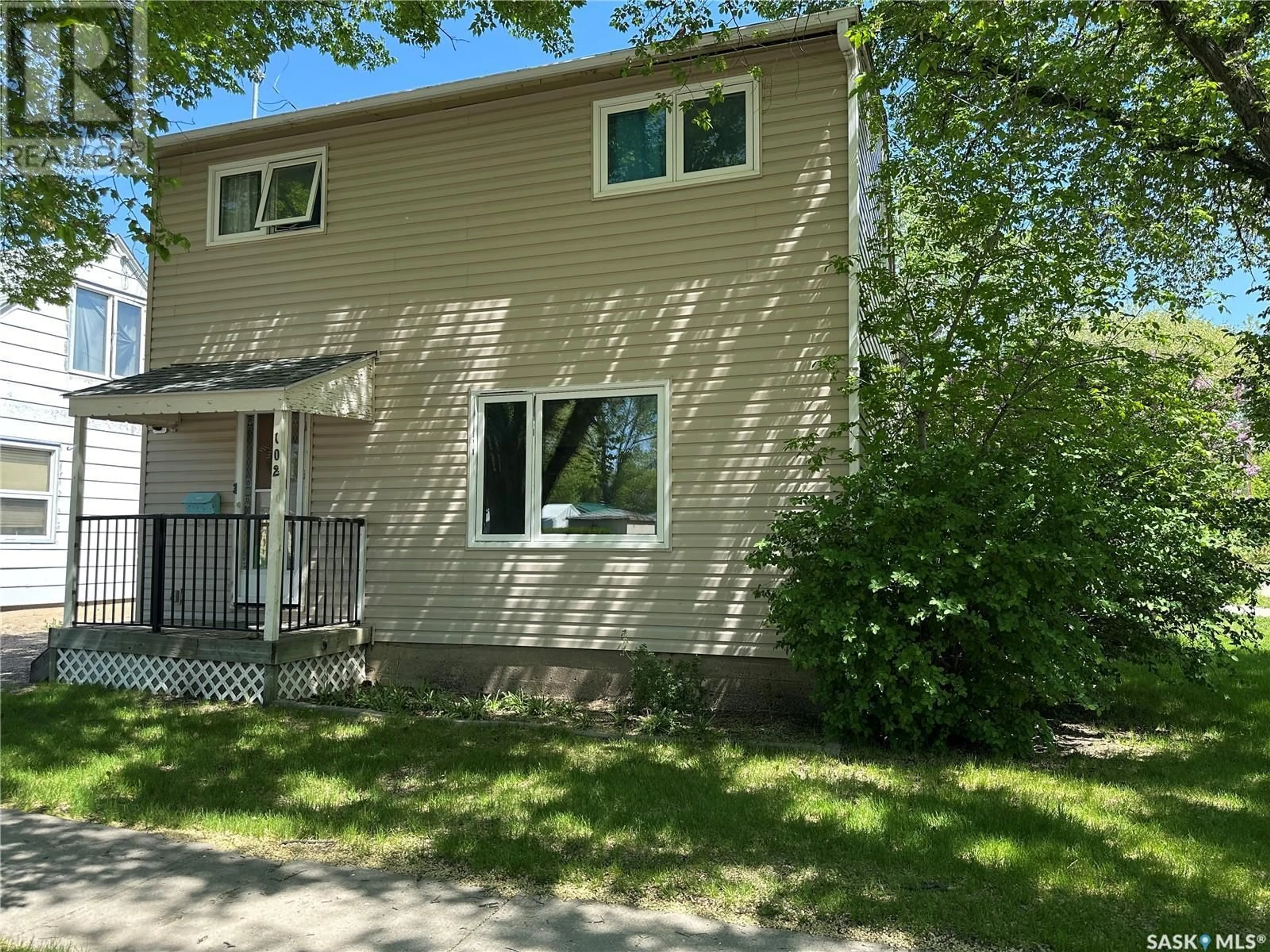 Home with vinyl exterior material, street for 102 9TH STREET, Weyburn Saskatchewan S4H1E7