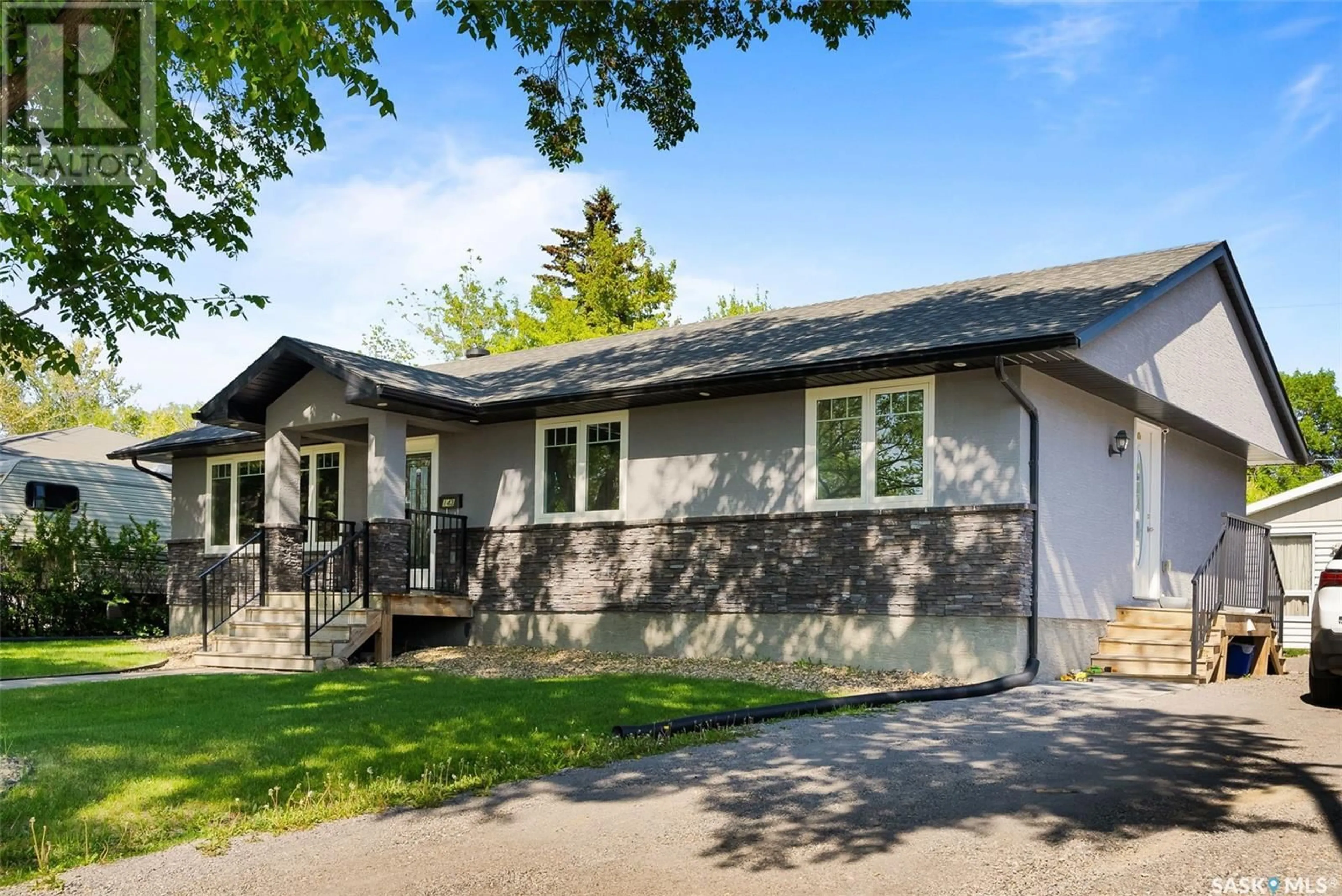 Home with vinyl exterior material, street for 143 MONTREAL STREET, Regina Saskatchewan S4R2S8