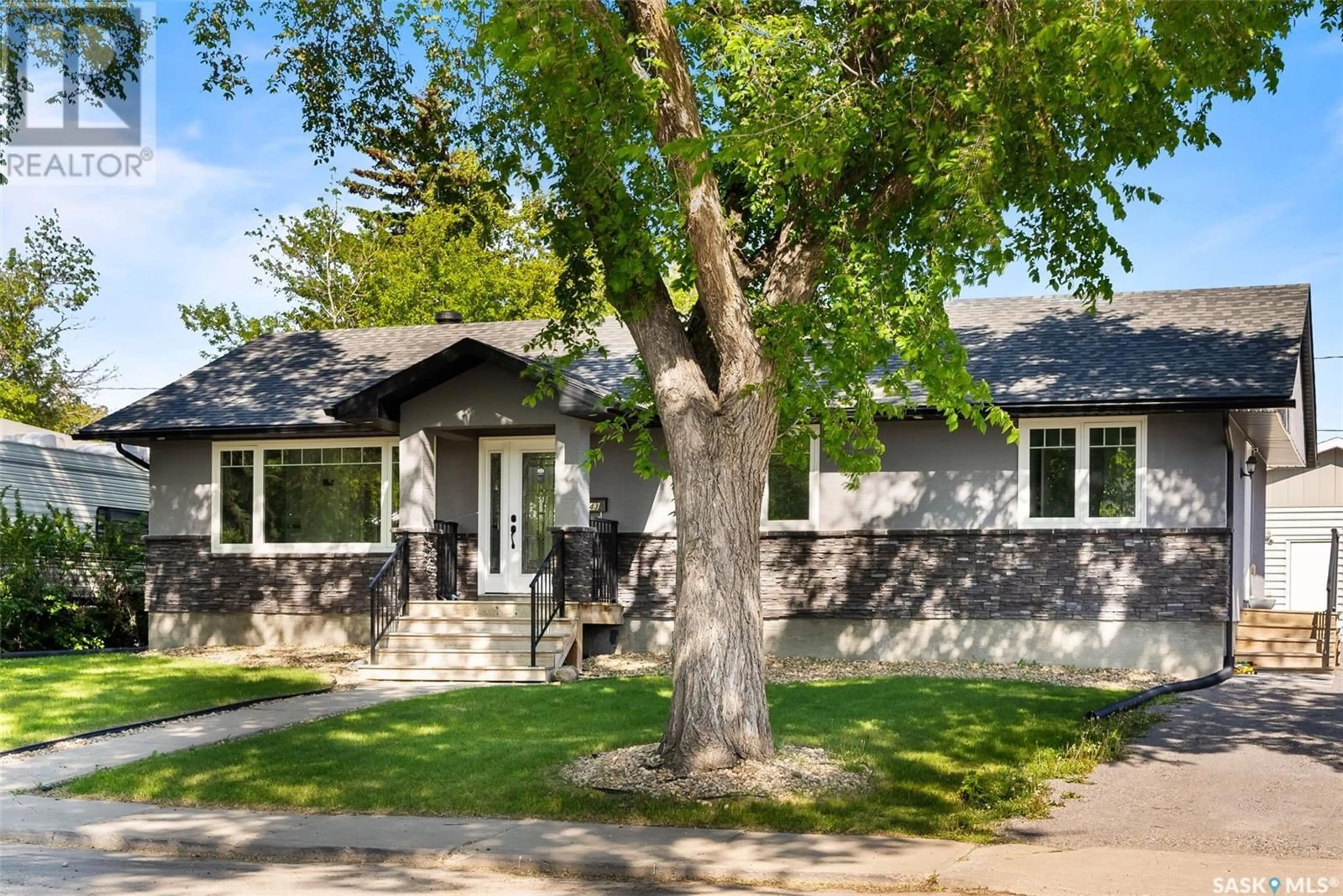 Home with vinyl exterior material, street for 143 MONTREAL STREET, Regina Saskatchewan S4R2S8