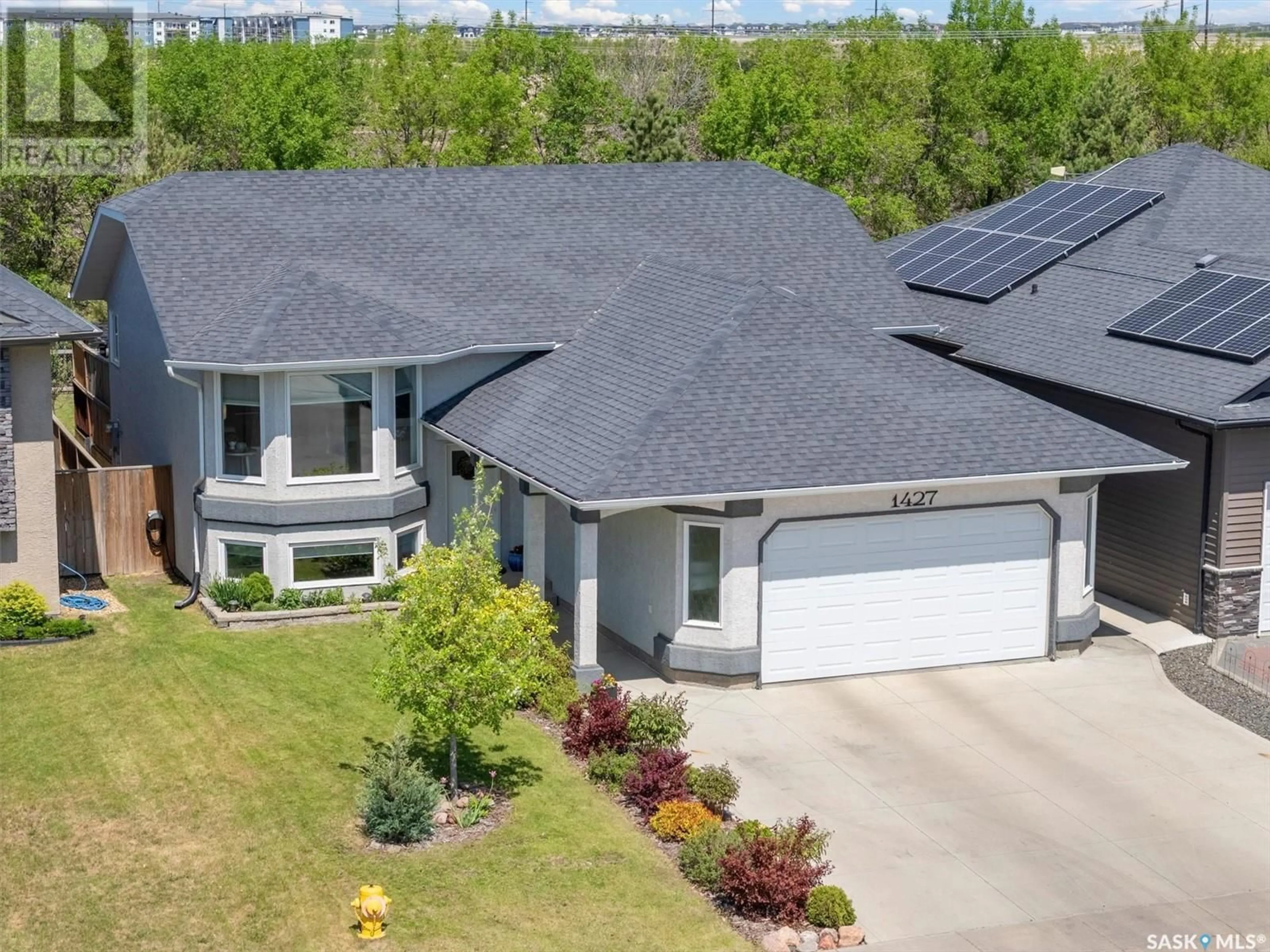 A pic from outside/outdoor area/front of a property/back of a property/a pic from drone, street for 1427 PATON CRESCENT, Saskatoon Saskatchewan S7W0C2