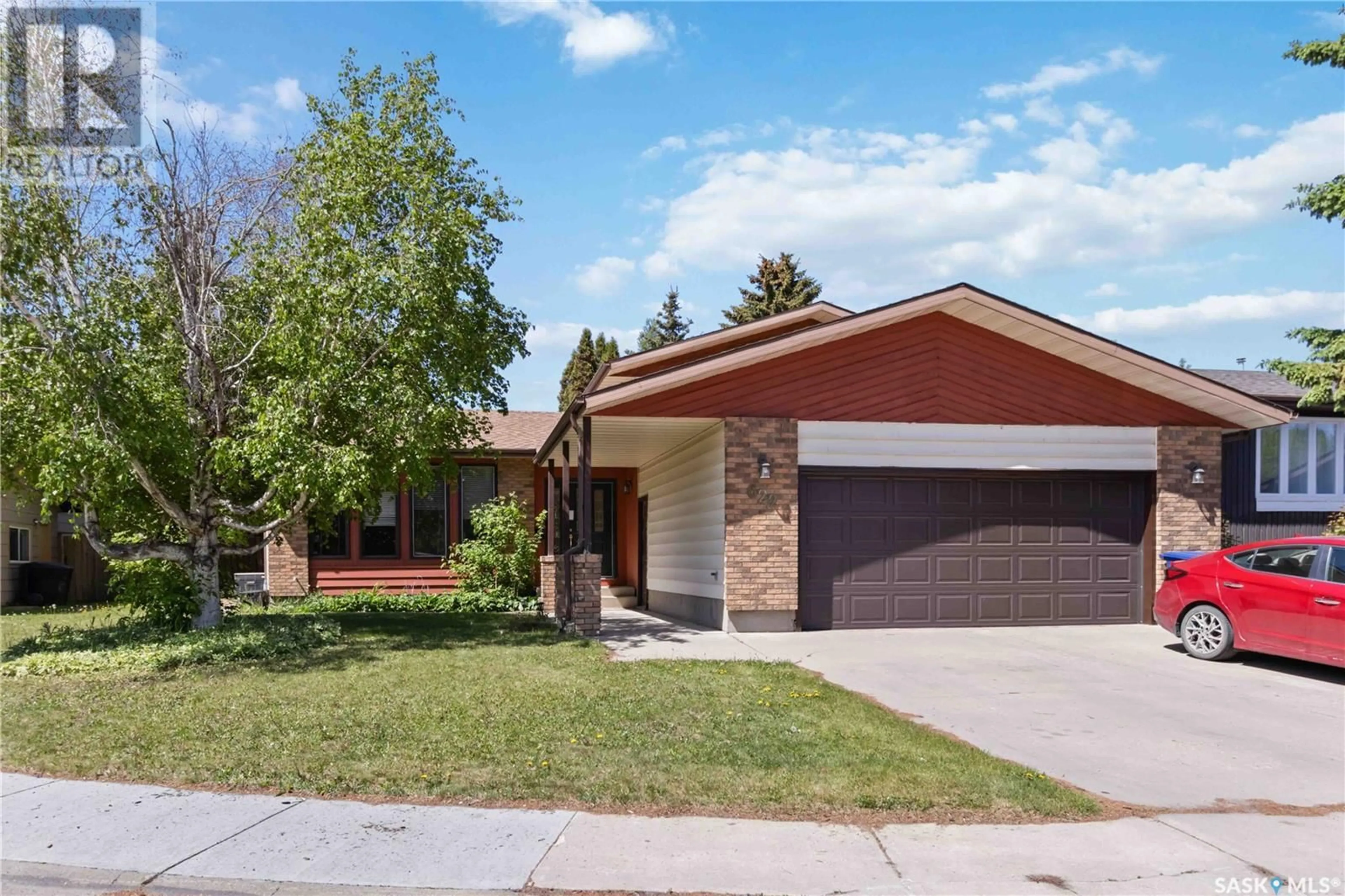 Home with brick exterior material, street for 622 WOLLASTON BAY, Saskatoon Saskatchewan S7J4C3