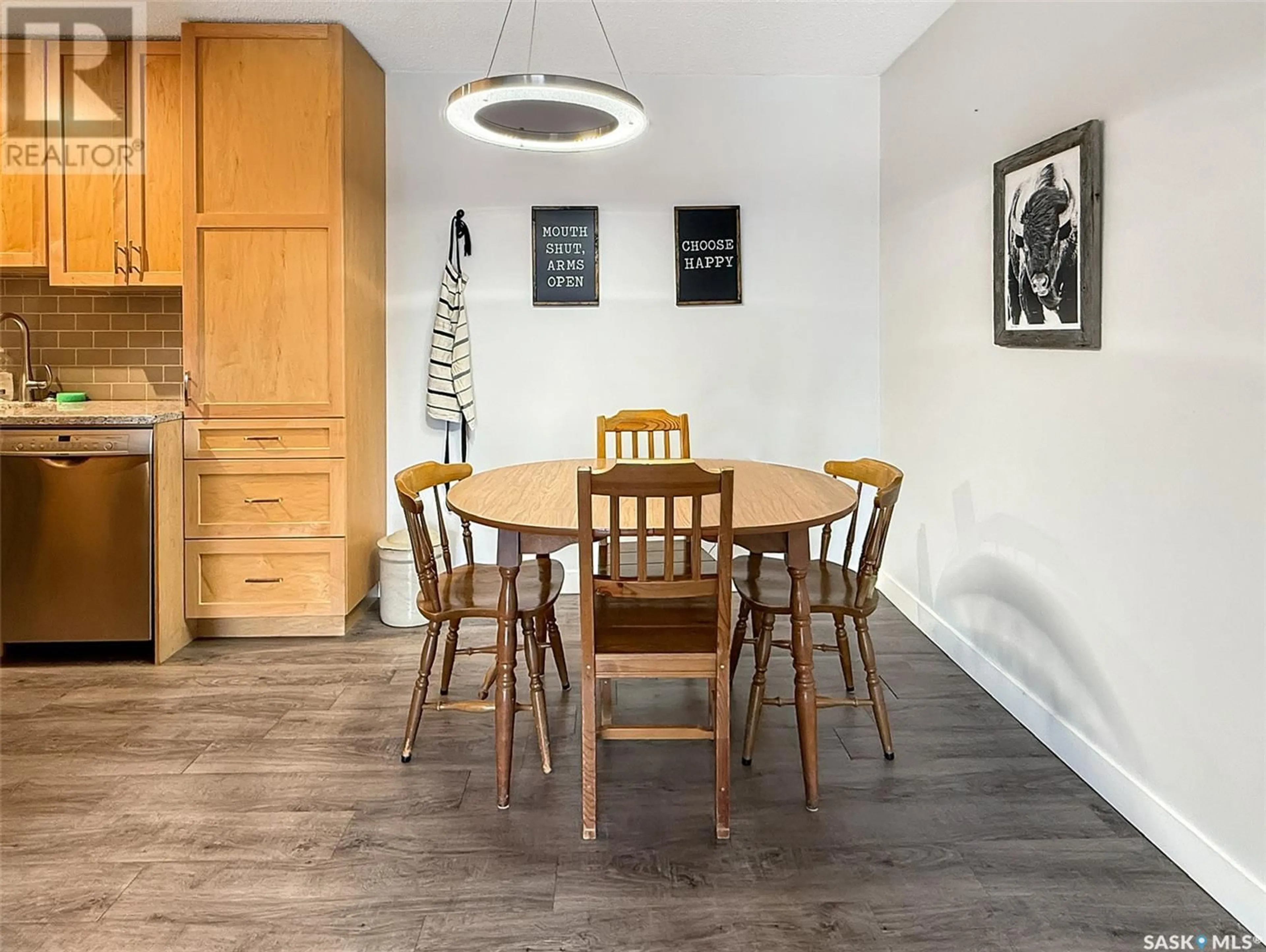Dining room, wood/laminate floor for 207 - 1110 9TH AVENUE, Swift Current Saskatchewan S9H2S9