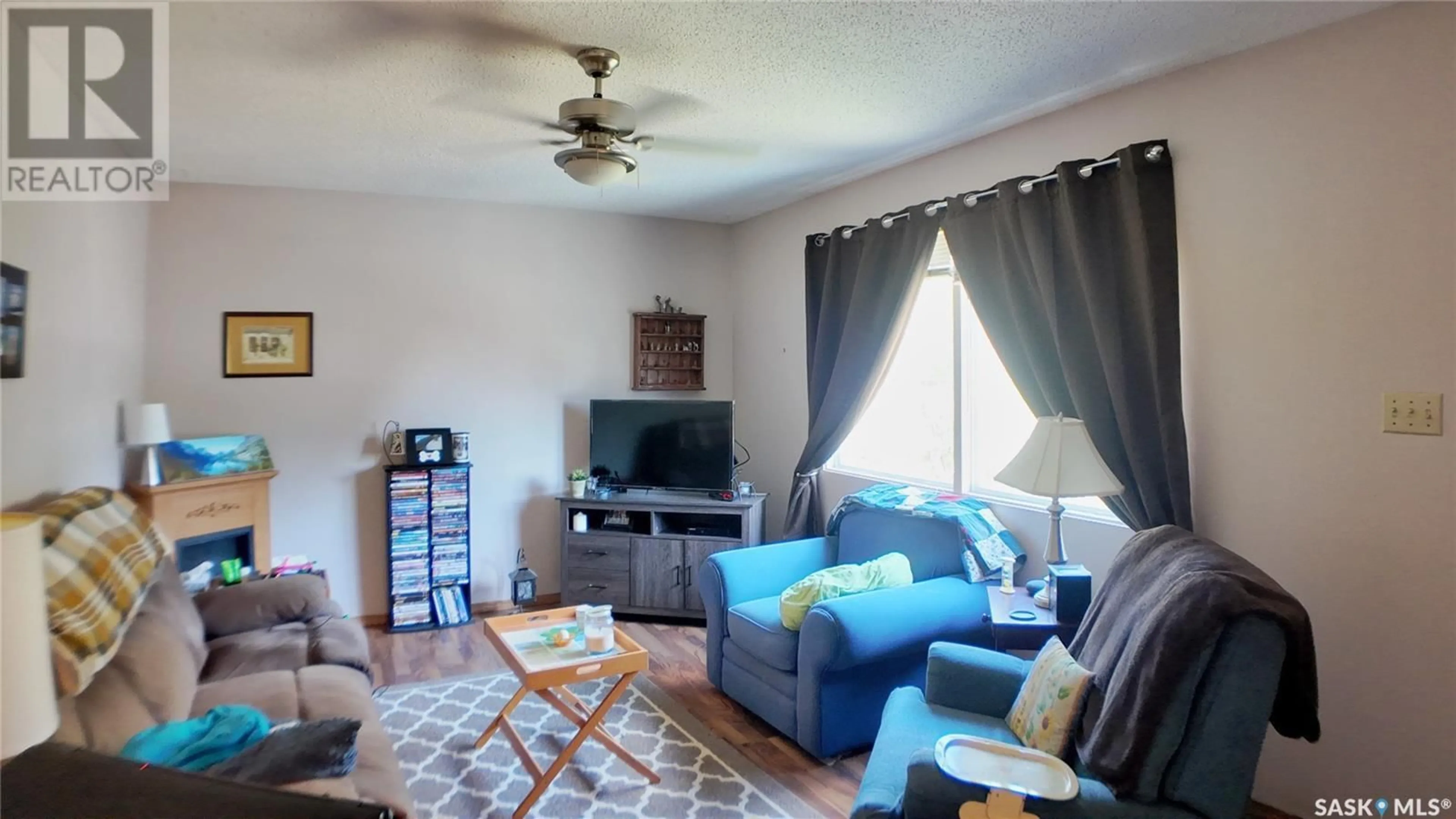 Living room with furniture, unknown for 10303 LAURIER CRESCENT, North Battleford Saskatchewan S9A3A5