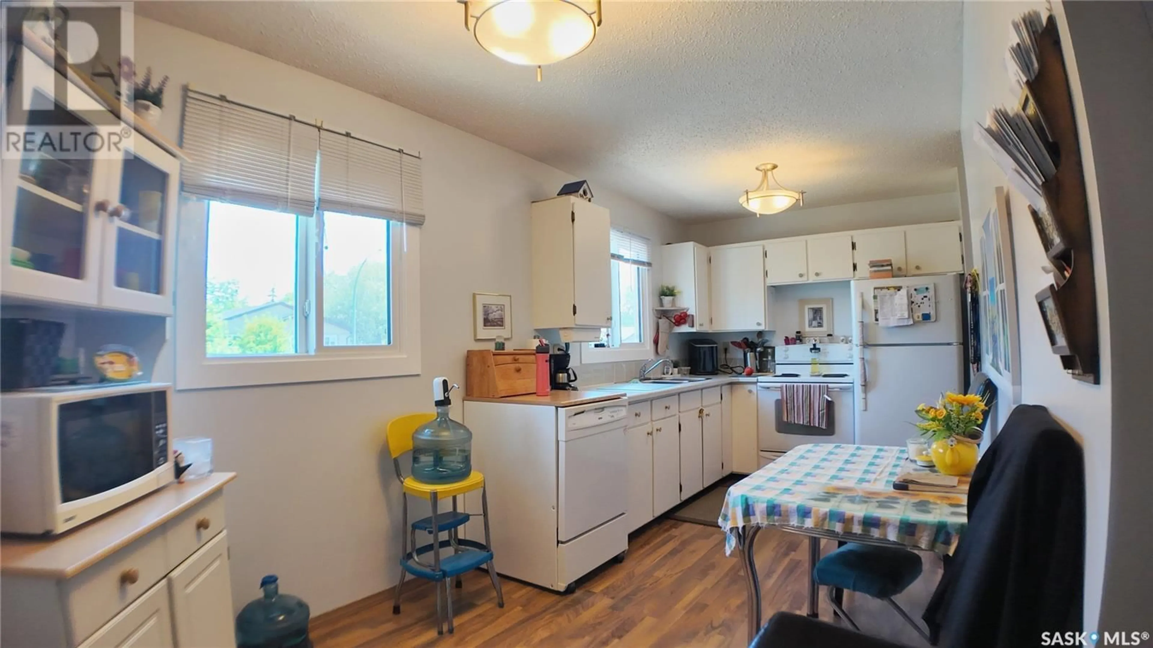 Kitchen with laundary machines, unknown for 10303 LAURIER CRESCENT, North Battleford Saskatchewan S9A3A5