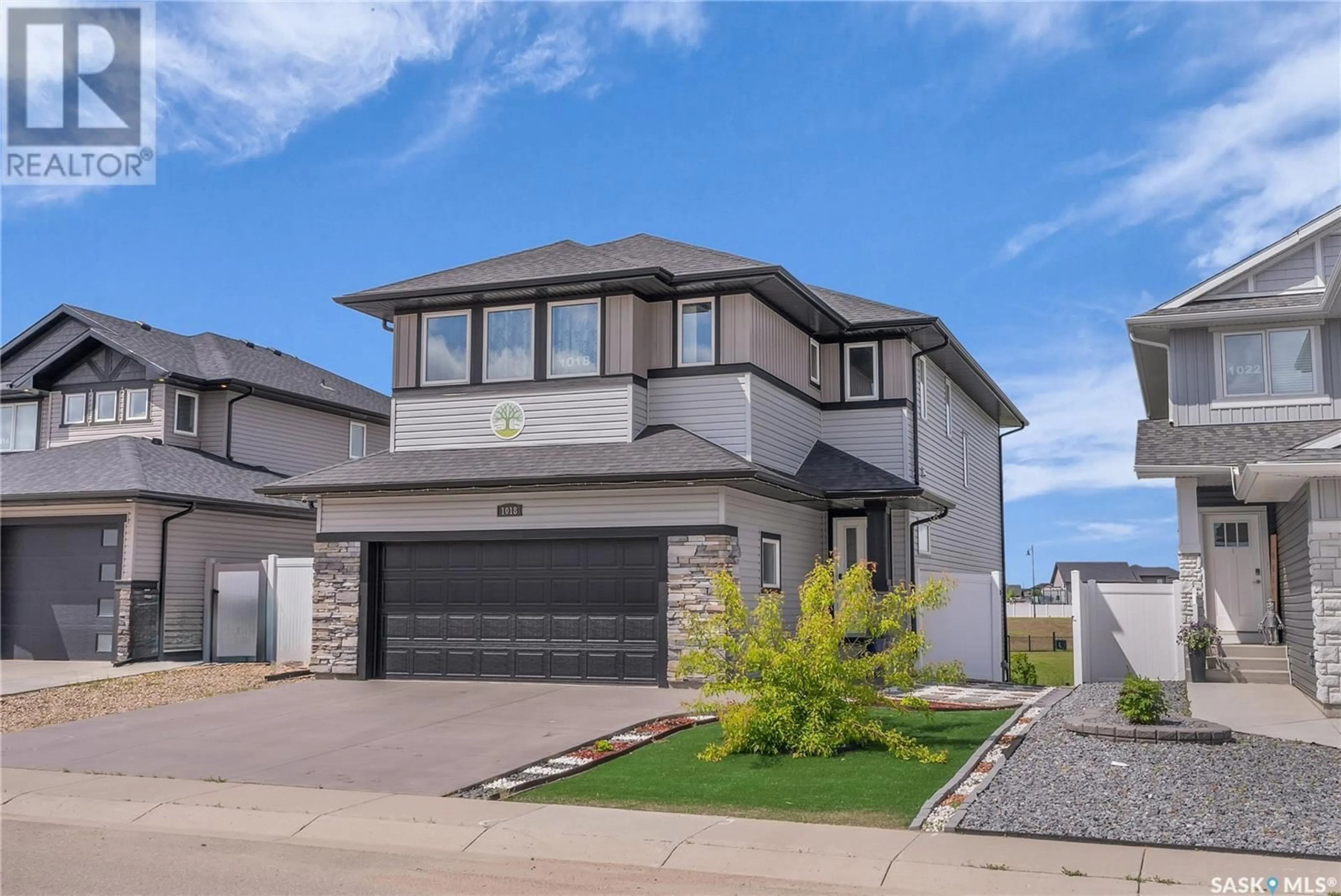 Home with brick exterior material, street for 1018 CHILDERS COURT, Saskatoon Saskatchewan S7L6T8