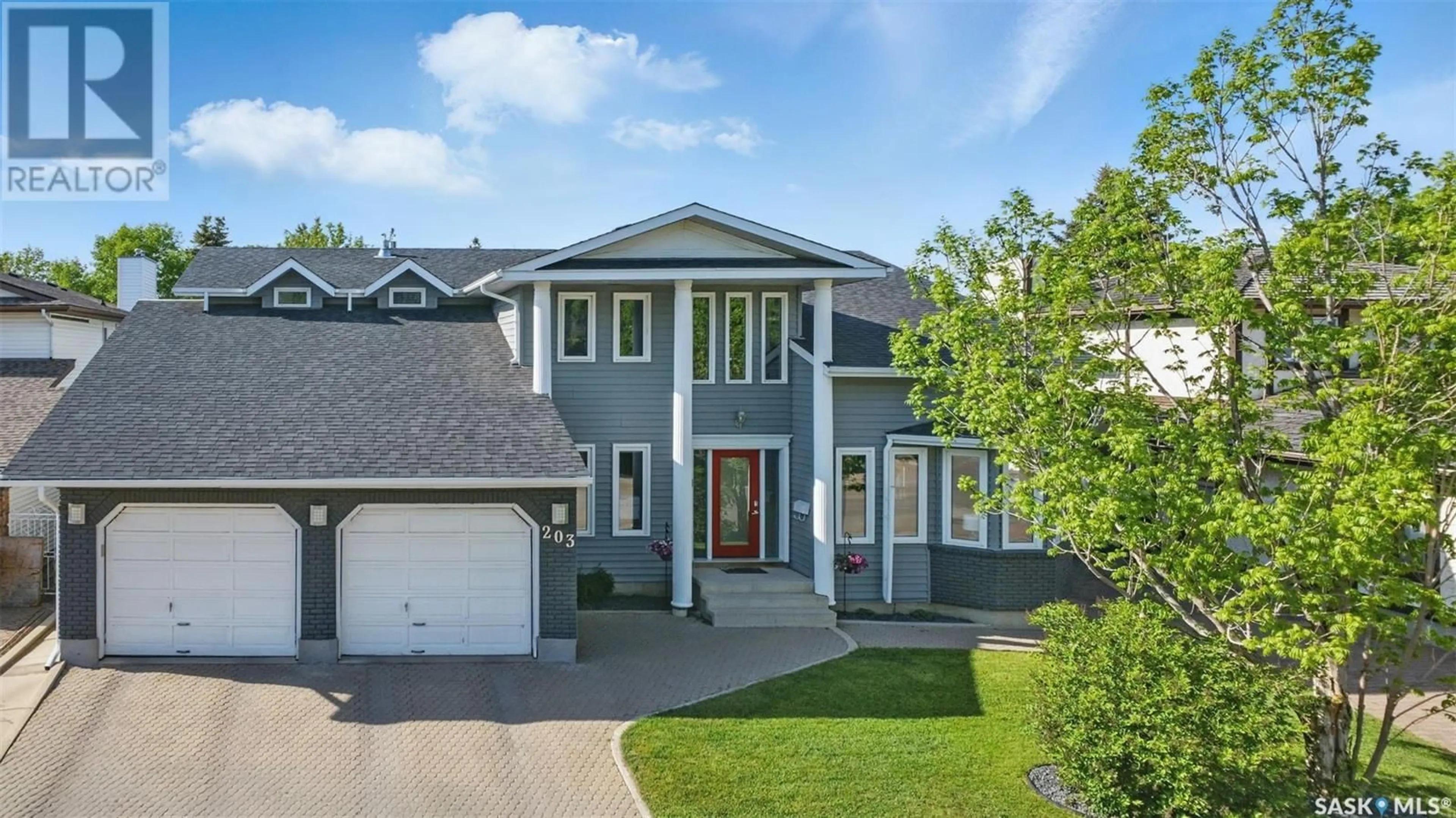 Home with vinyl exterior material, street for 203 MALLIN CRESCENT, Saskatoon Saskatchewan S7K7W8