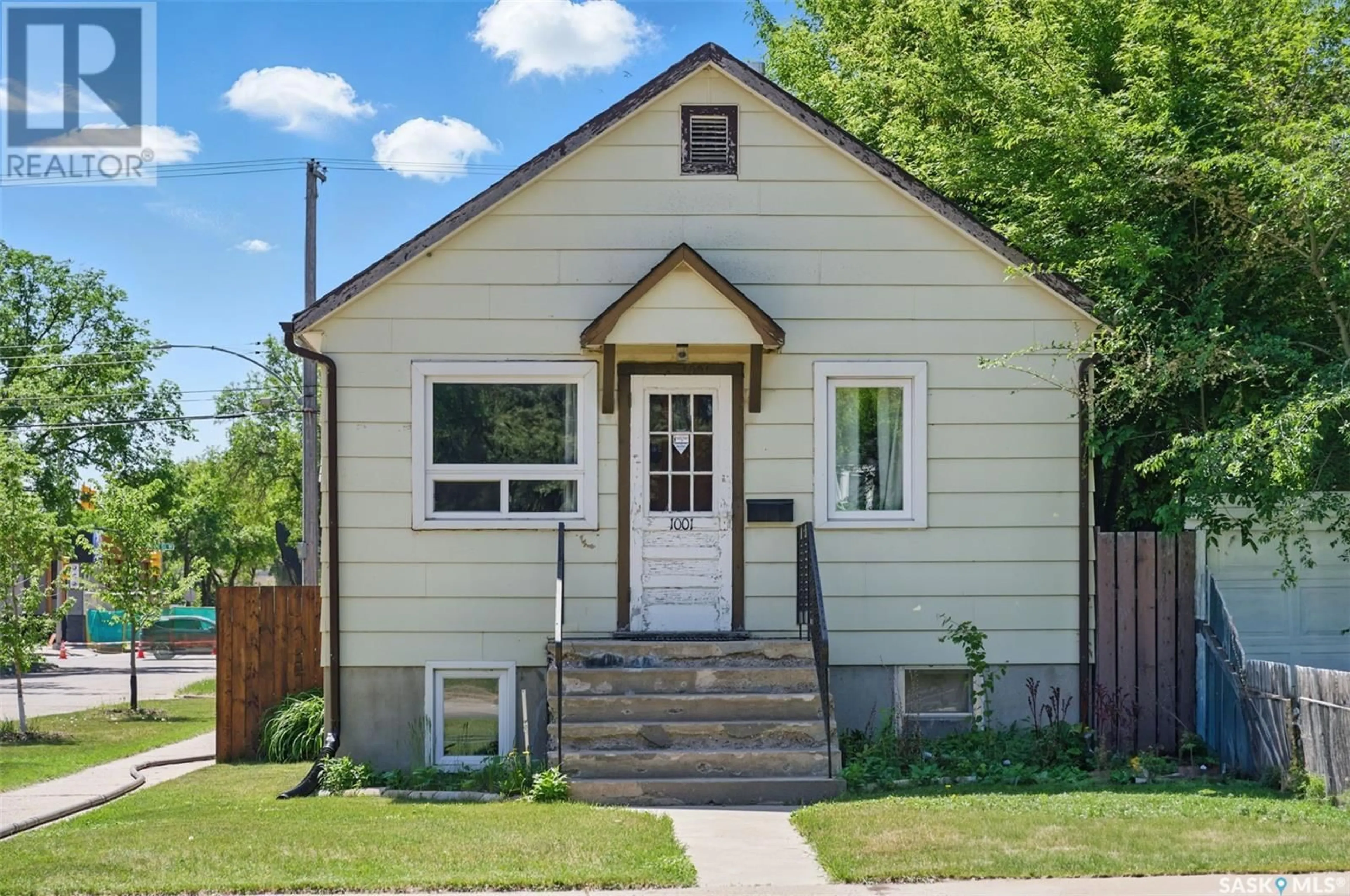 Home with vinyl exterior material, street for 1001 23RD STREET, Saskatoon Saskatchewan S7L0A6