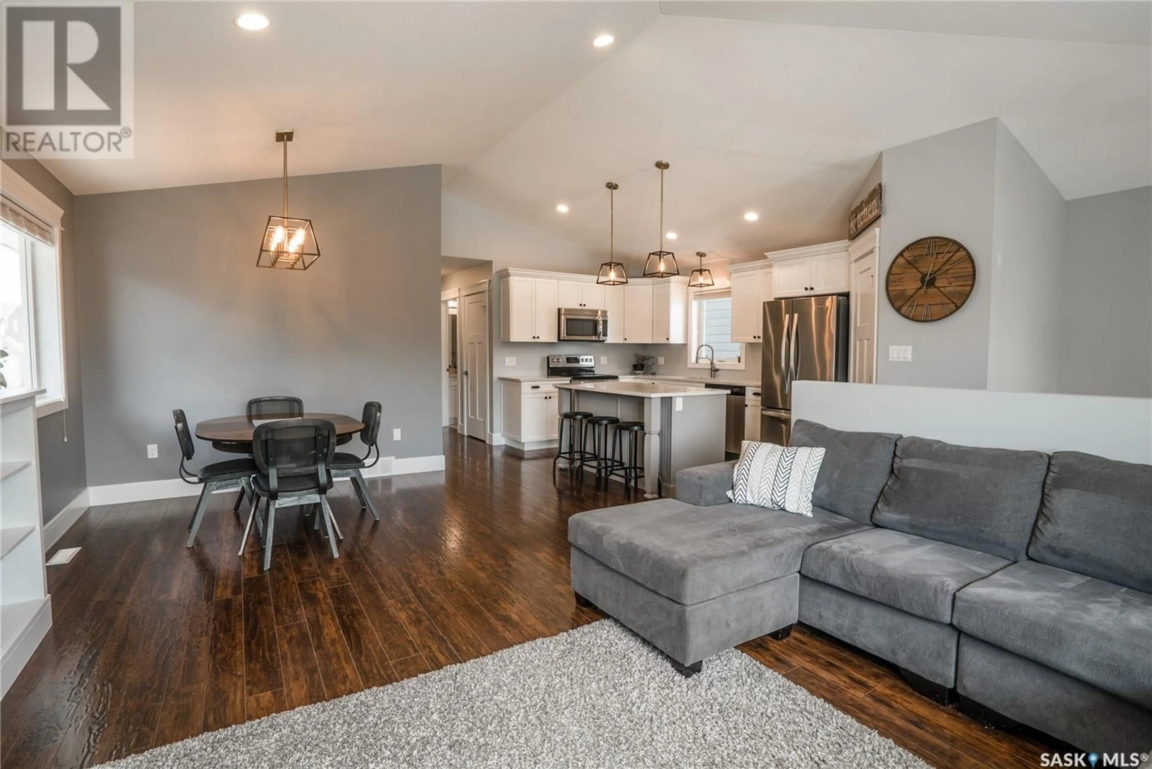 Open concept kitchen, wood/laminate floor for 327 EATON LANE, Saskatoon Saskatchewan S7V0H5