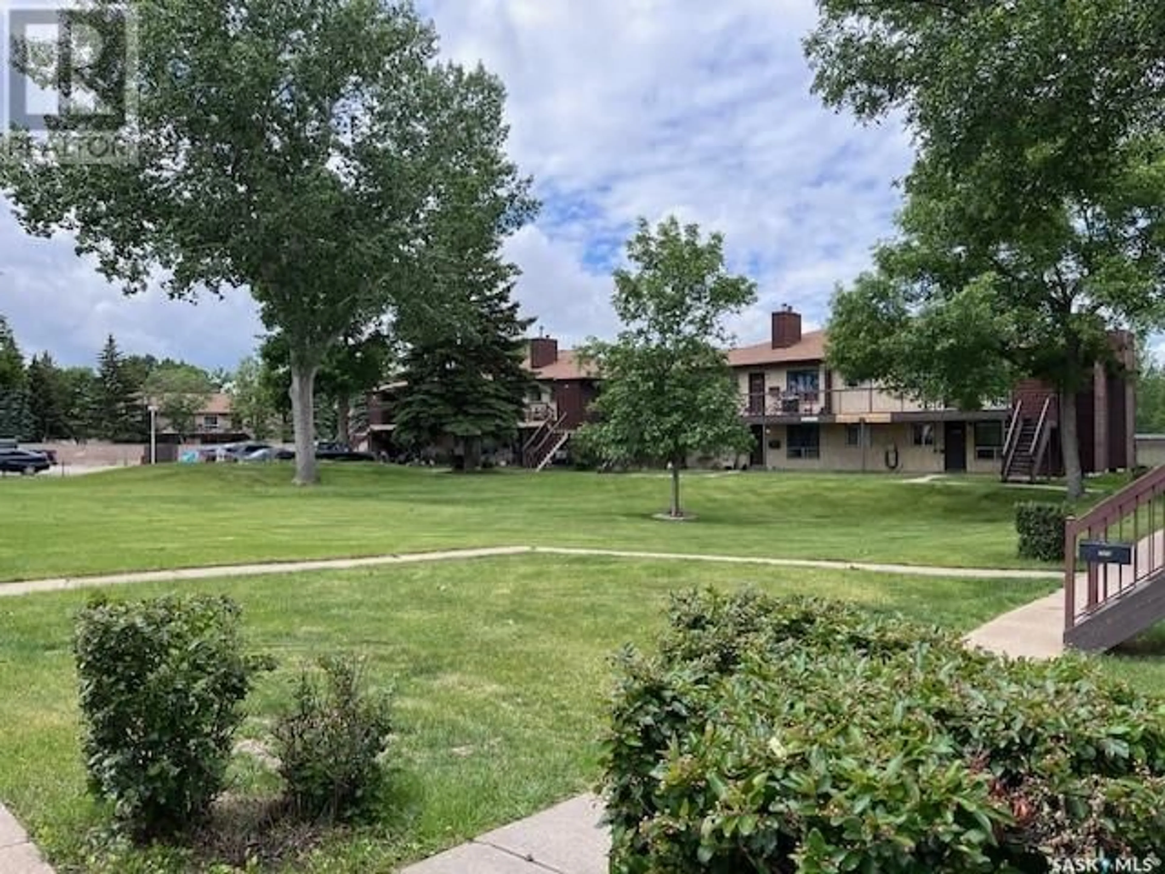 A pic from outside/outdoor area/front of a property/back of a property/a pic from drone, mountain view for 204A - 1350 GORDON ROAD, Moose Jaw Saskatchewan S6H7K9