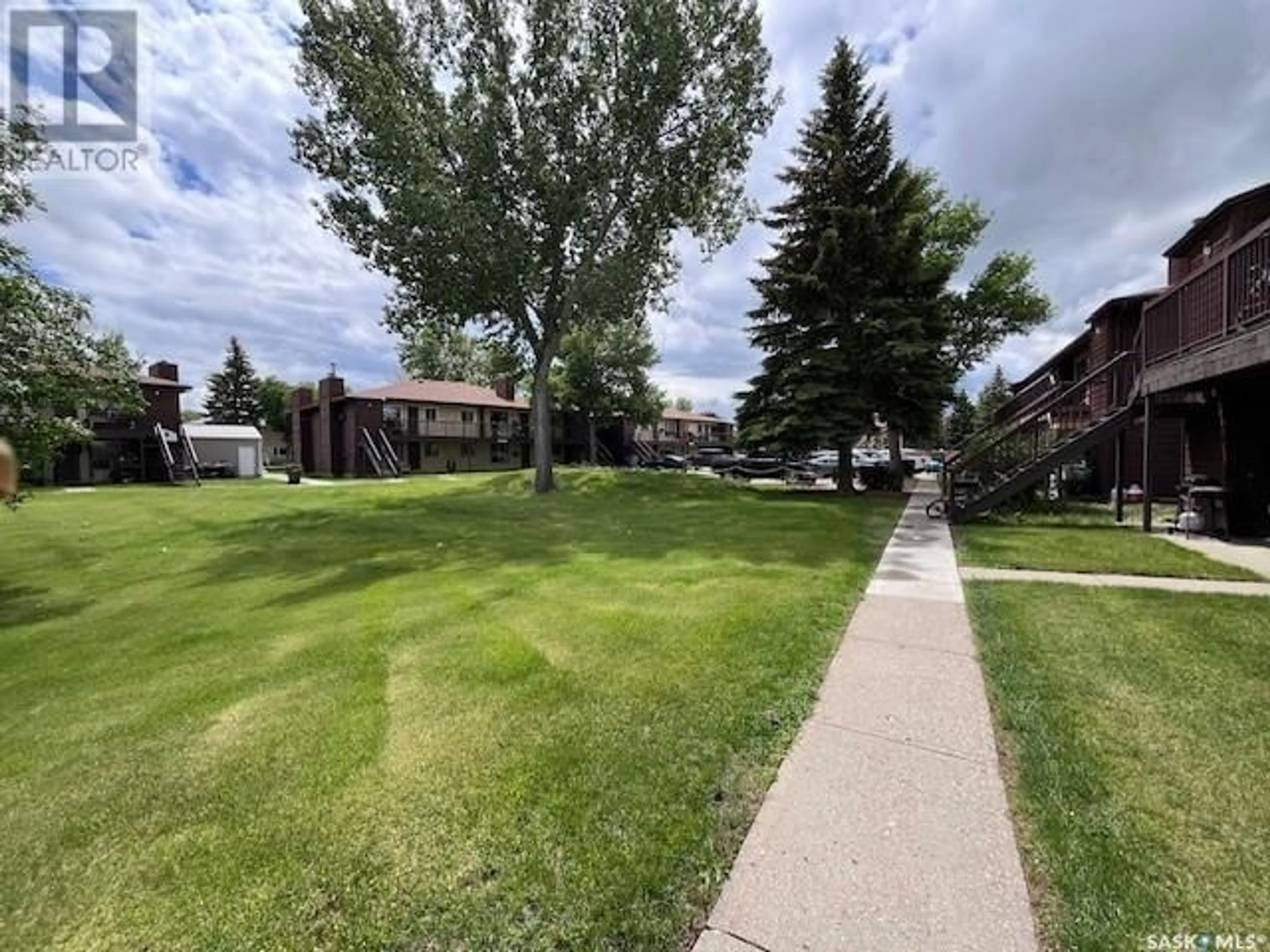 A pic from outside/outdoor area/front of a property/back of a property/a pic from drone, unknown for 204A - 1350 GORDON ROAD, Moose Jaw Saskatchewan S6H7K9