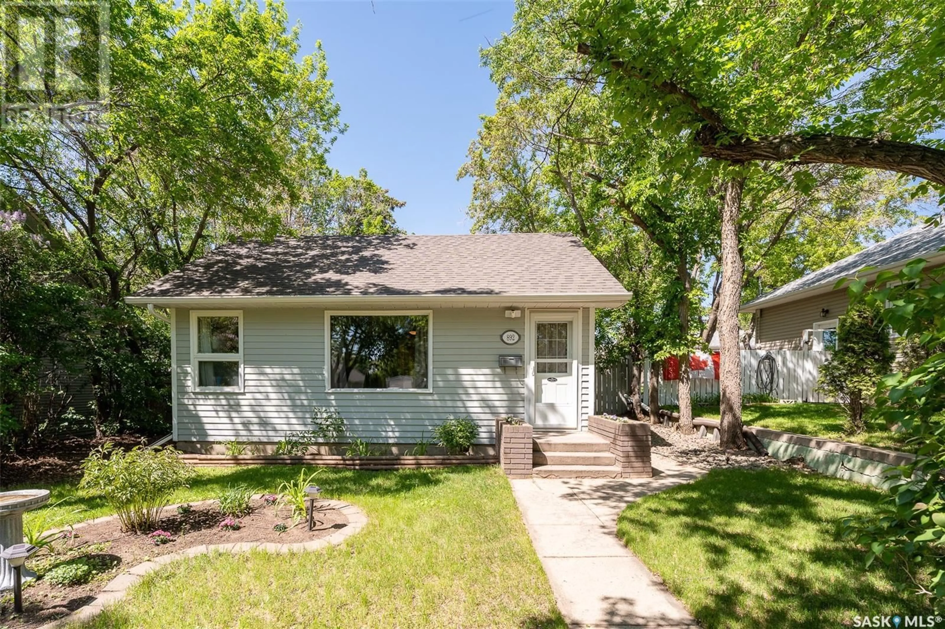 Home with vinyl exterior material, street for 892 ALGOMA AVENUE, Moose Jaw Saskatchewan S6H3Z3